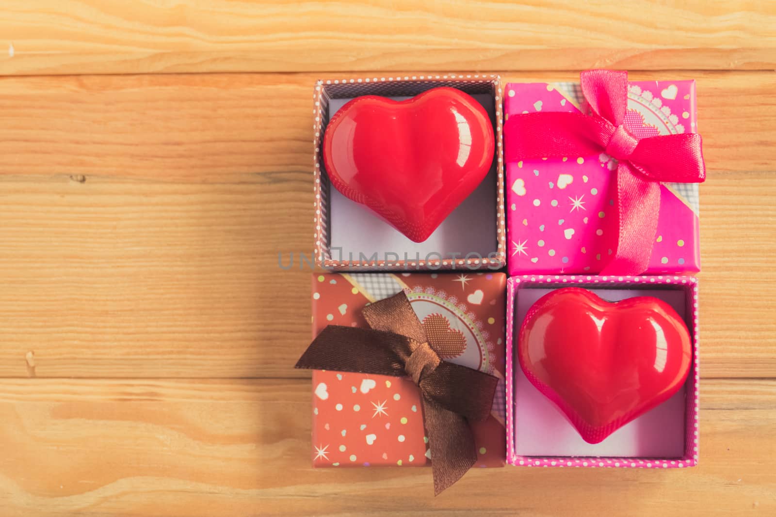 Gift of love. hearty gift. A gift box with a red heart inside. by teerawit