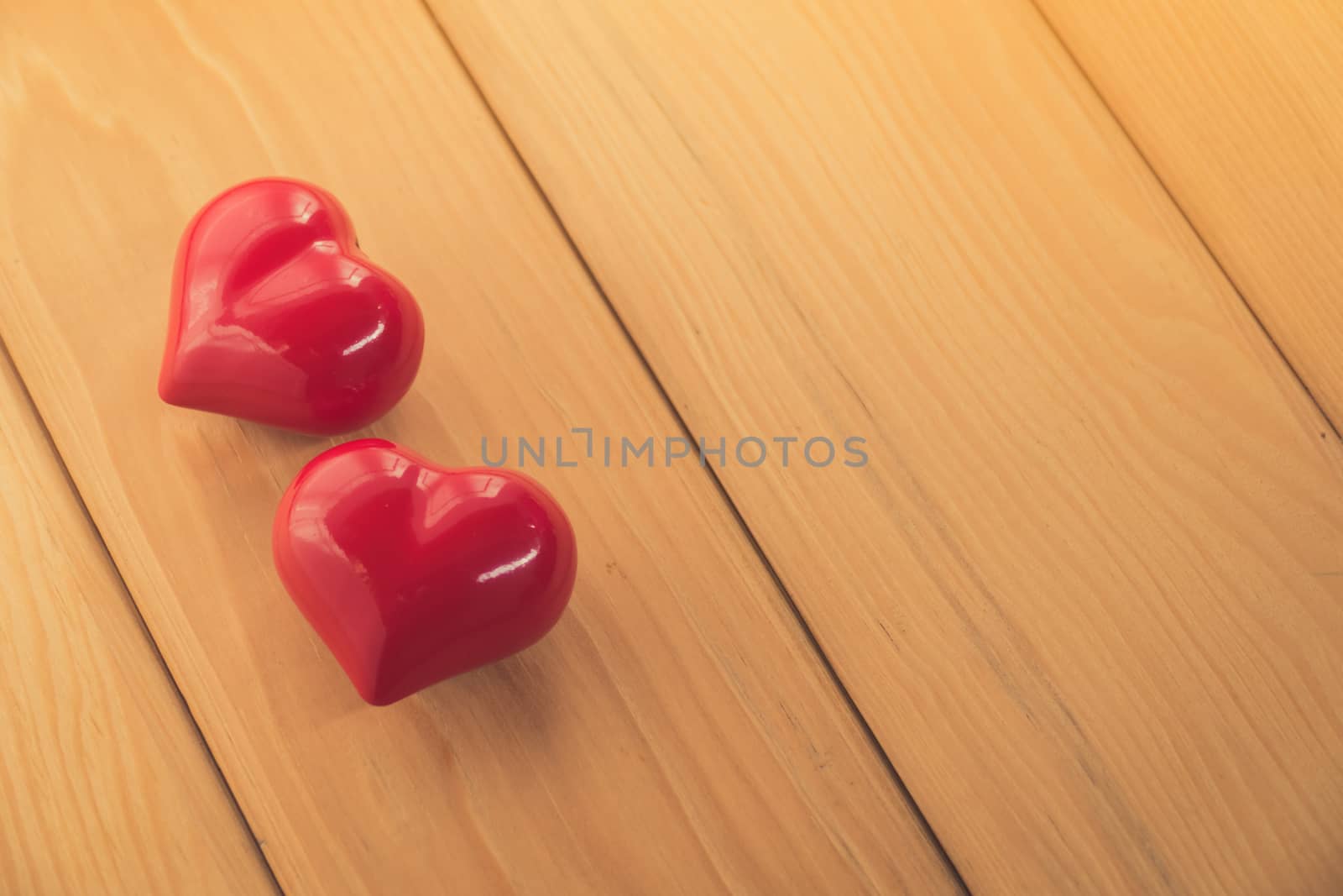 red heart on rustic wood with copy space by teerawit