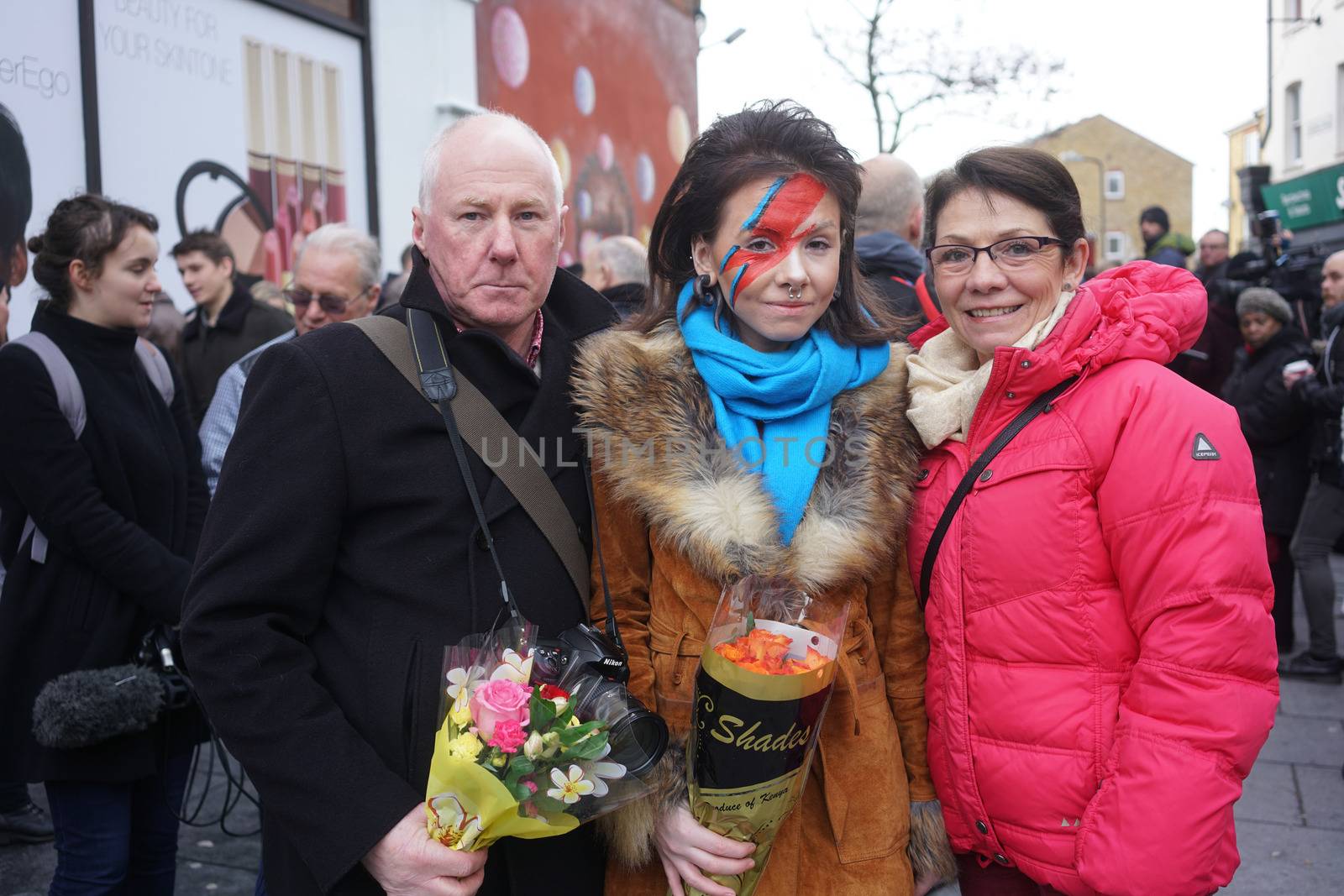 UNITED KINGDOM, London: Fans gather to pay tribute to British singer David Bowie, following the announcement of Bowie's death, in Brixton, south London, on January 11, 2016. British music icon David Bowie died of cancer at the age of 69, drawing an outpouring of tributes for the innovative star famed for groundbreaking hits like Ziggy Stardust and his theatrical shape-shifting style. 