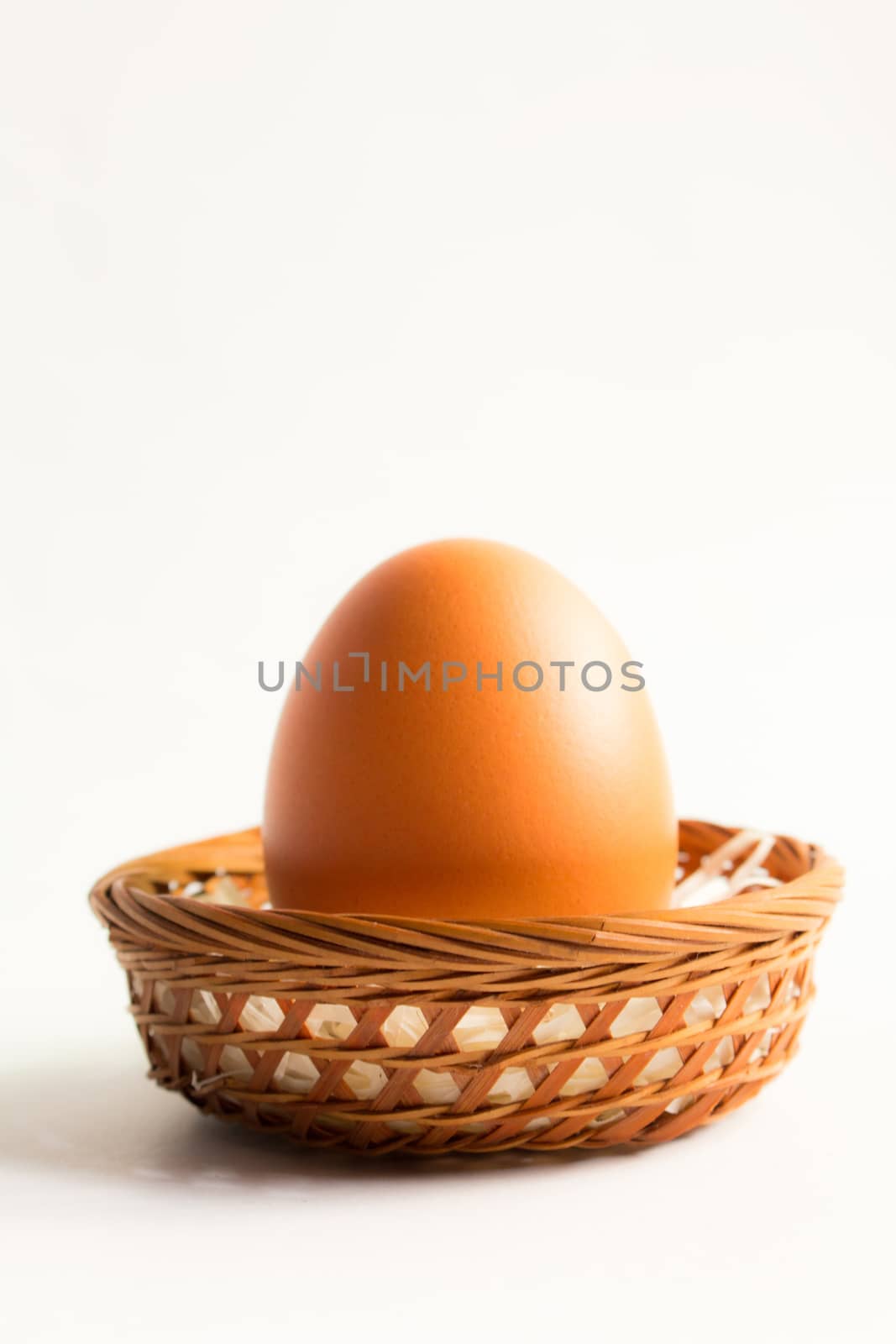 egg in basket wicker on white background,Duck eggs in baskets .