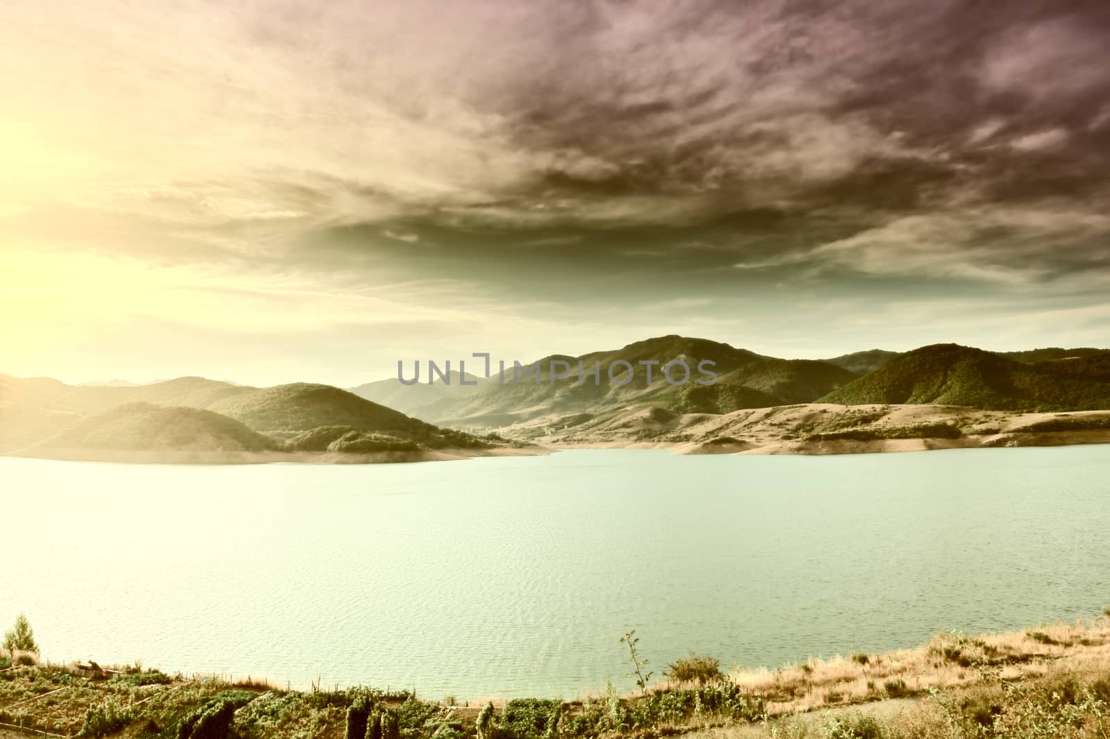Sunset over a Mountain Lake in Spain, Vintage Style Toned Picture