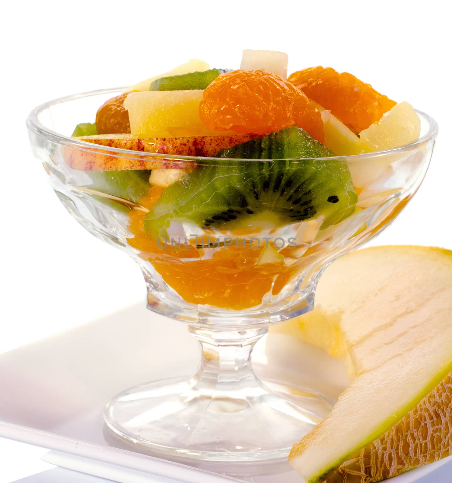 fresh fruit cocktail with apple kiwi in glass