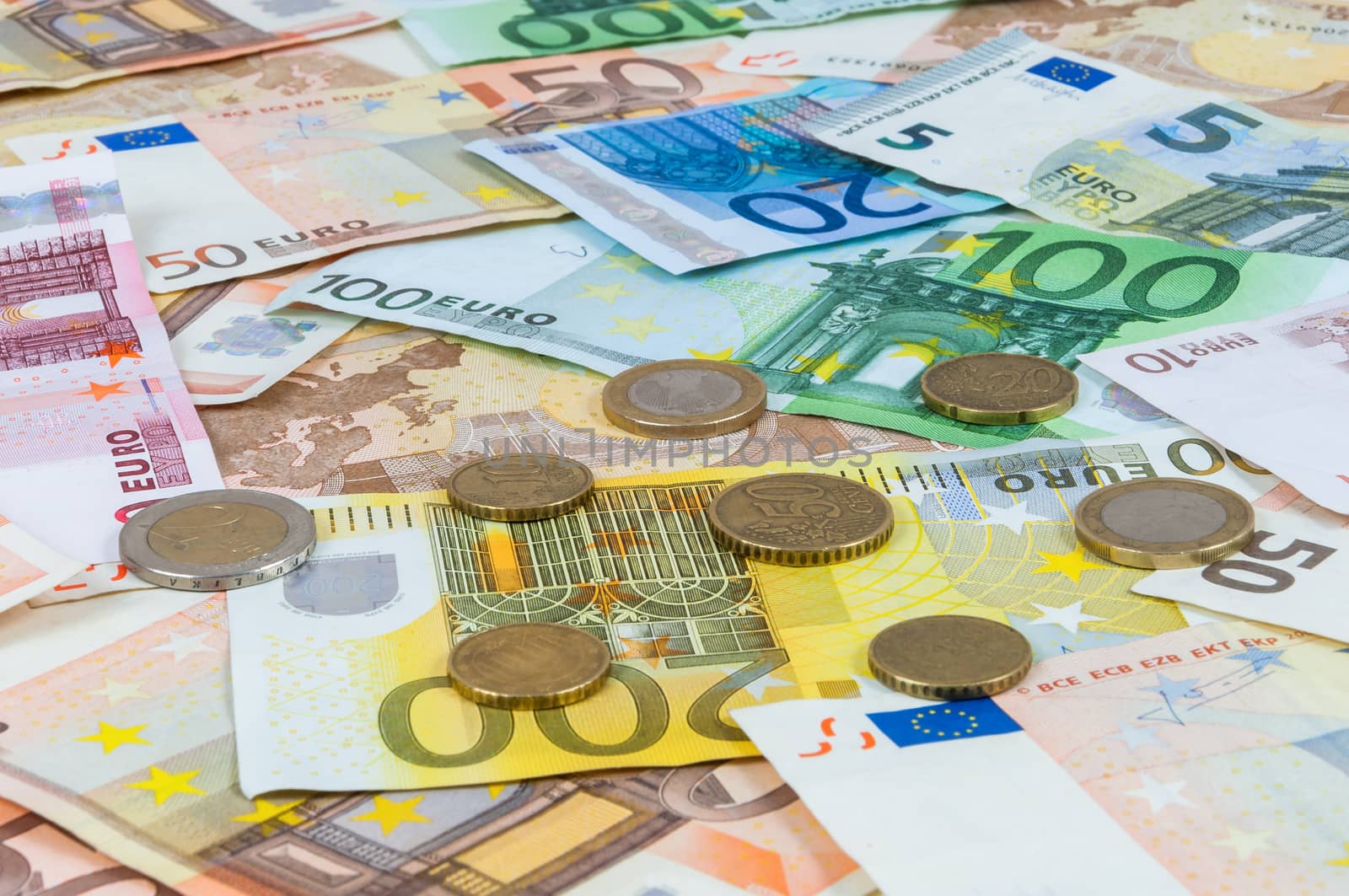 Background of euro banknotes and coins by mkos83