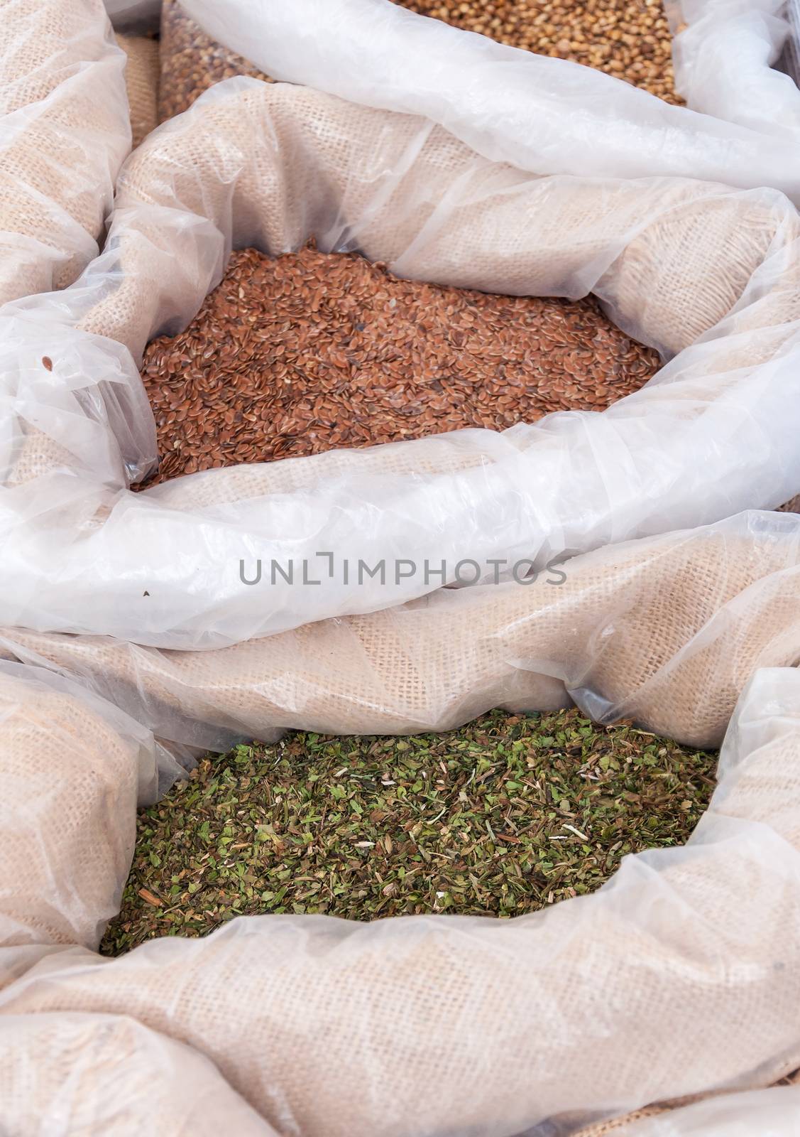 Bags with lovage and linseed on a spice market