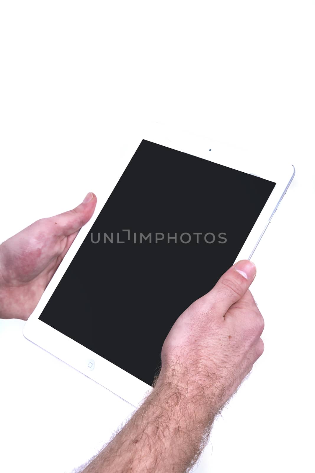 Tablet in men’s hands isolated on a white background
