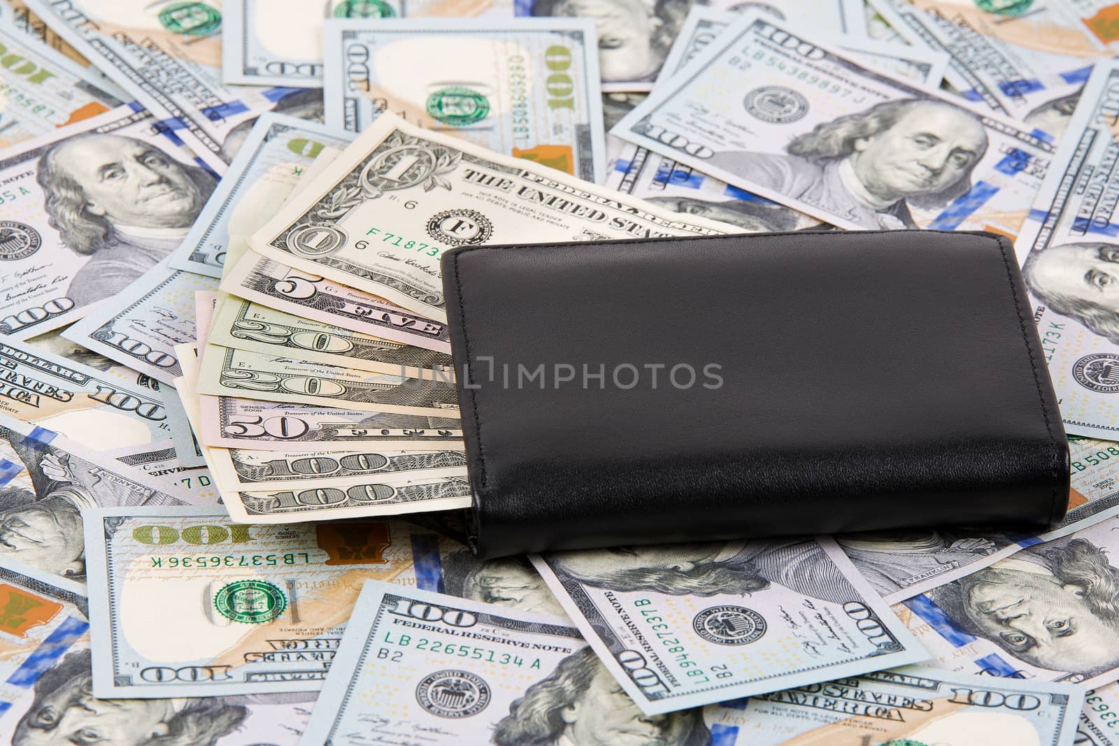 Black wallet with American dollars