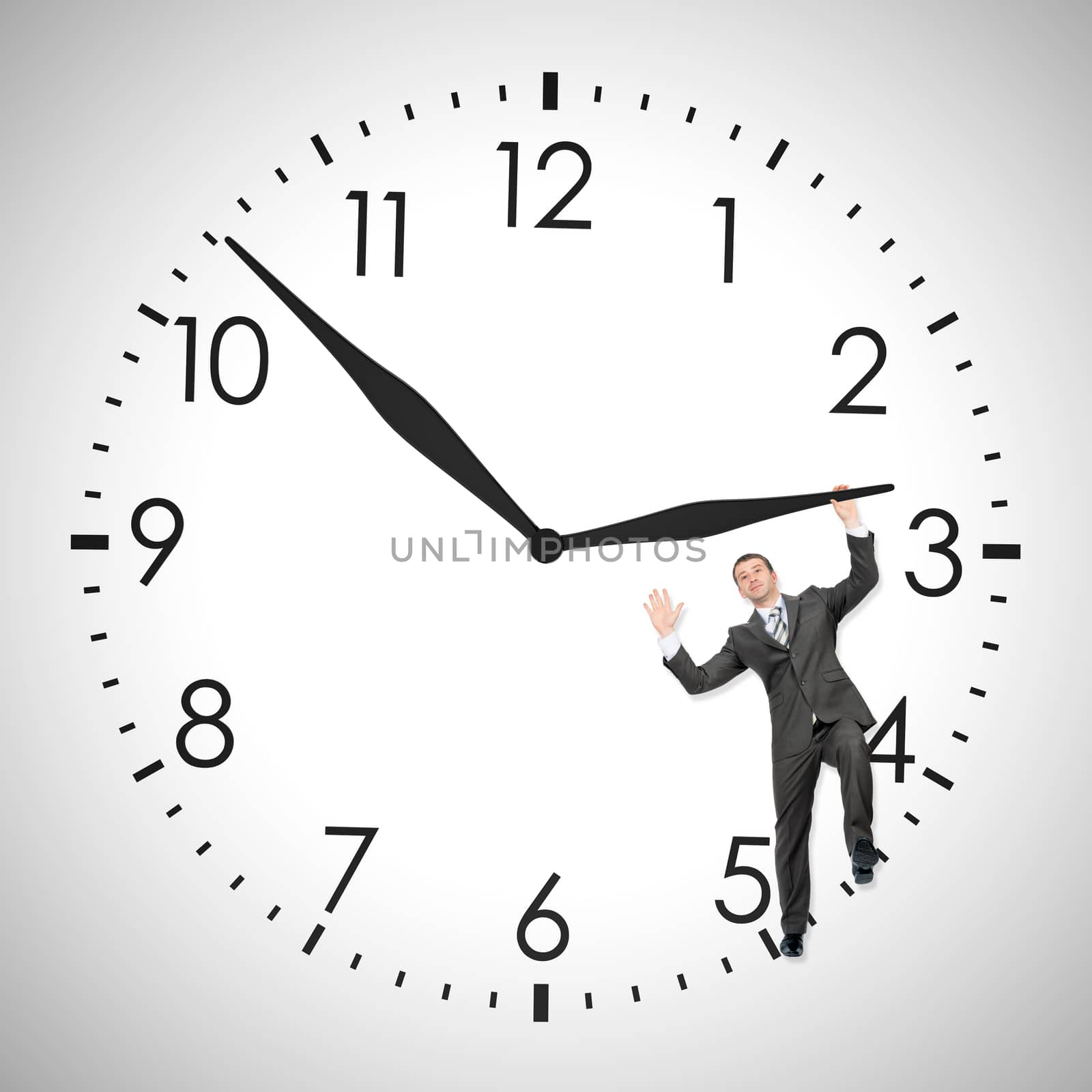 Businessman pushing clock hand inside clock isolated on white background