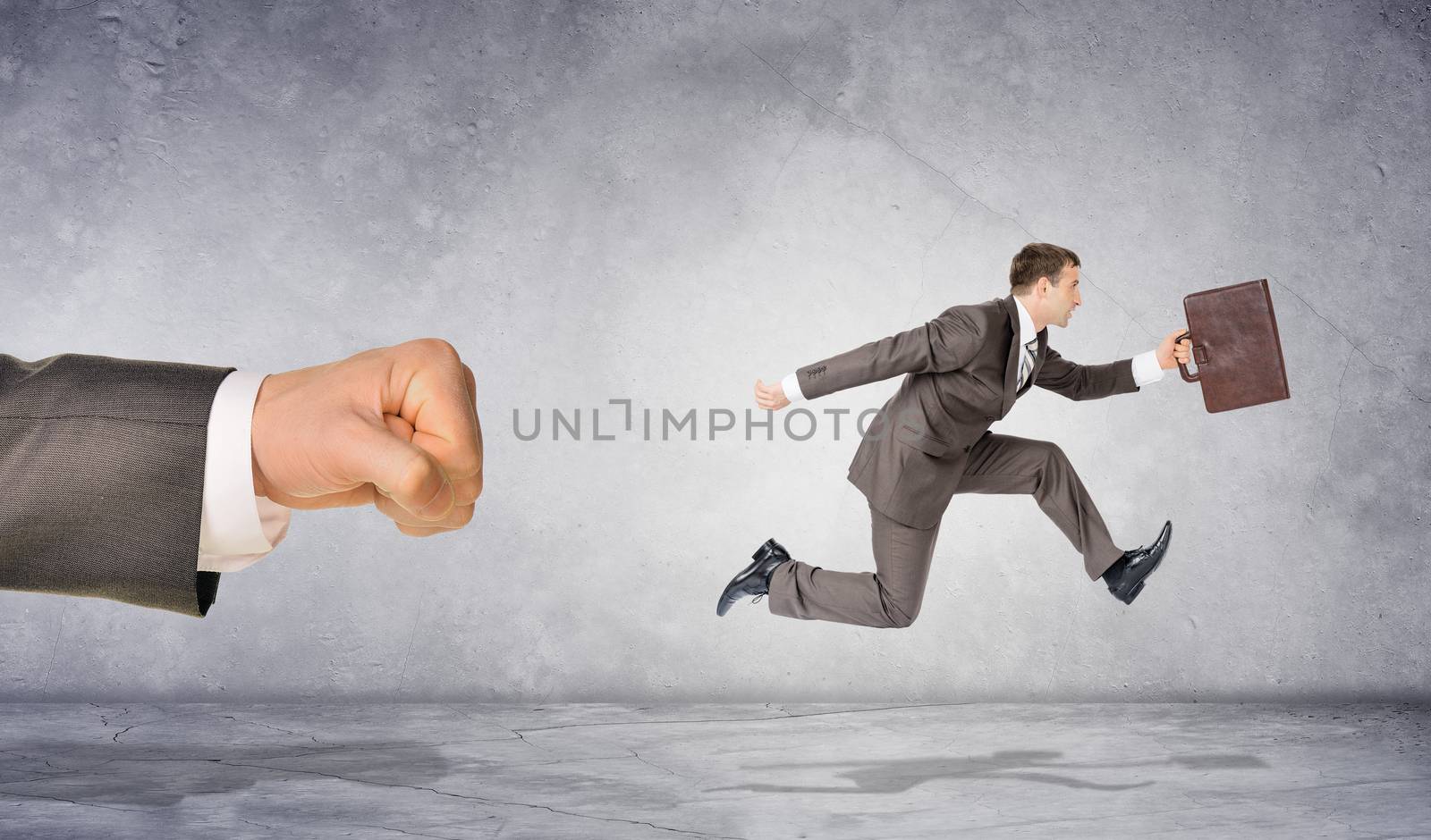 Mans fist and running businessman by cherezoff