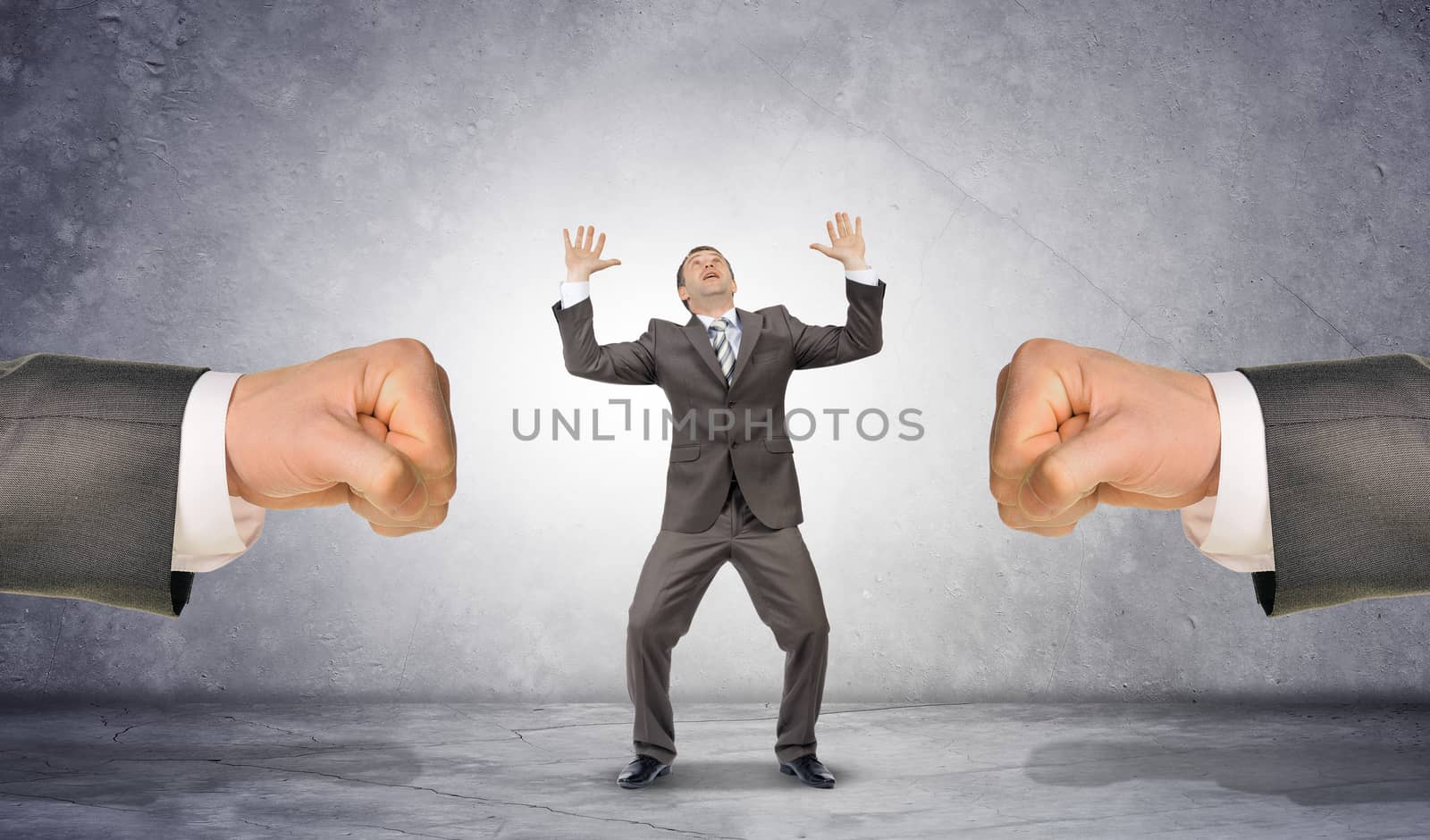 Man fists and scared businessman by cherezoff