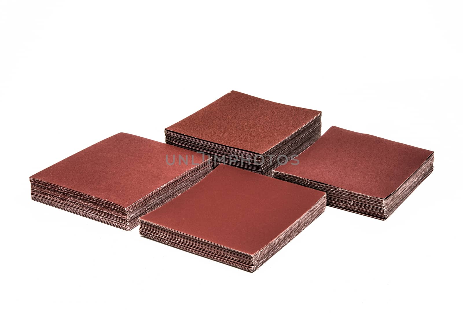 4 Sets of sand papers on white background