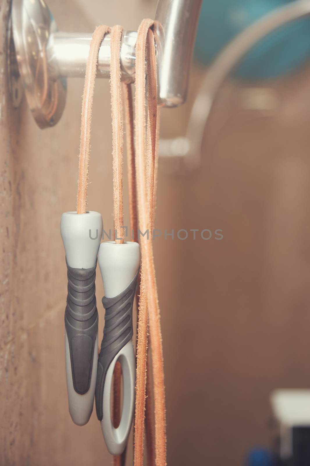 Jump rope in the gym class. Close-up vertical photo