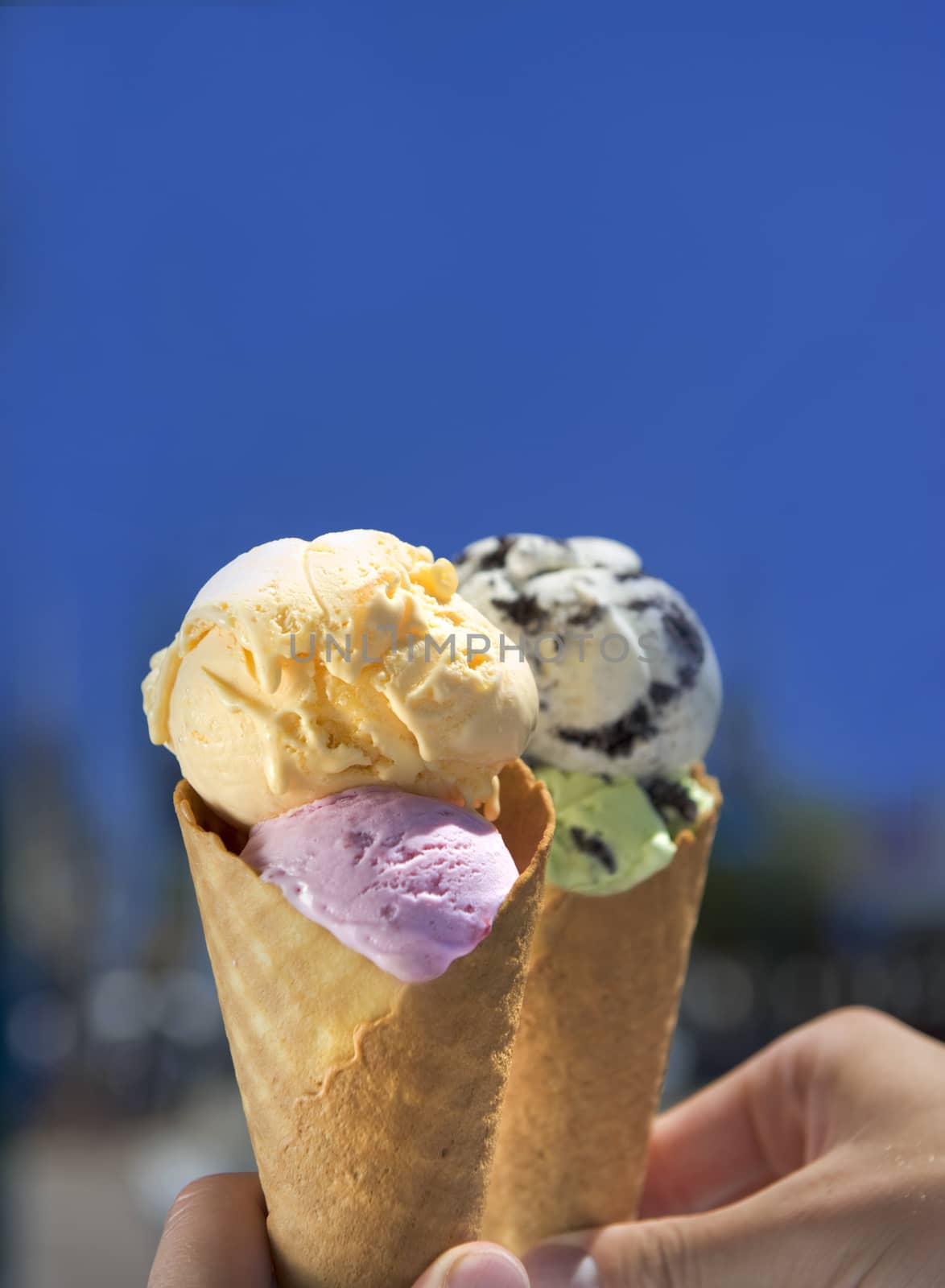 Delicious vivid colored home made ice cream in a waffle cone