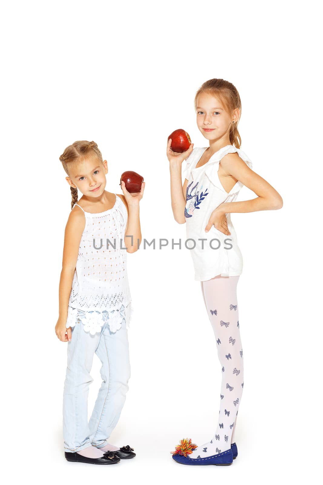 Beauty young girls with fresh apples. Healthy lifestyle. Happiness. White background.