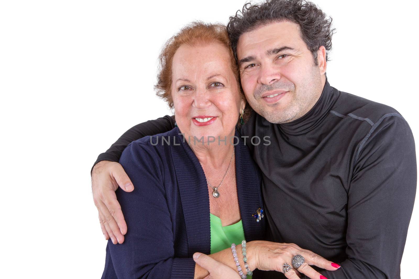 Mother and son sharing a tender moment as they hug each other affectionately with an elderly stylish lady and attractive curly haired middle-aged man isolated on white