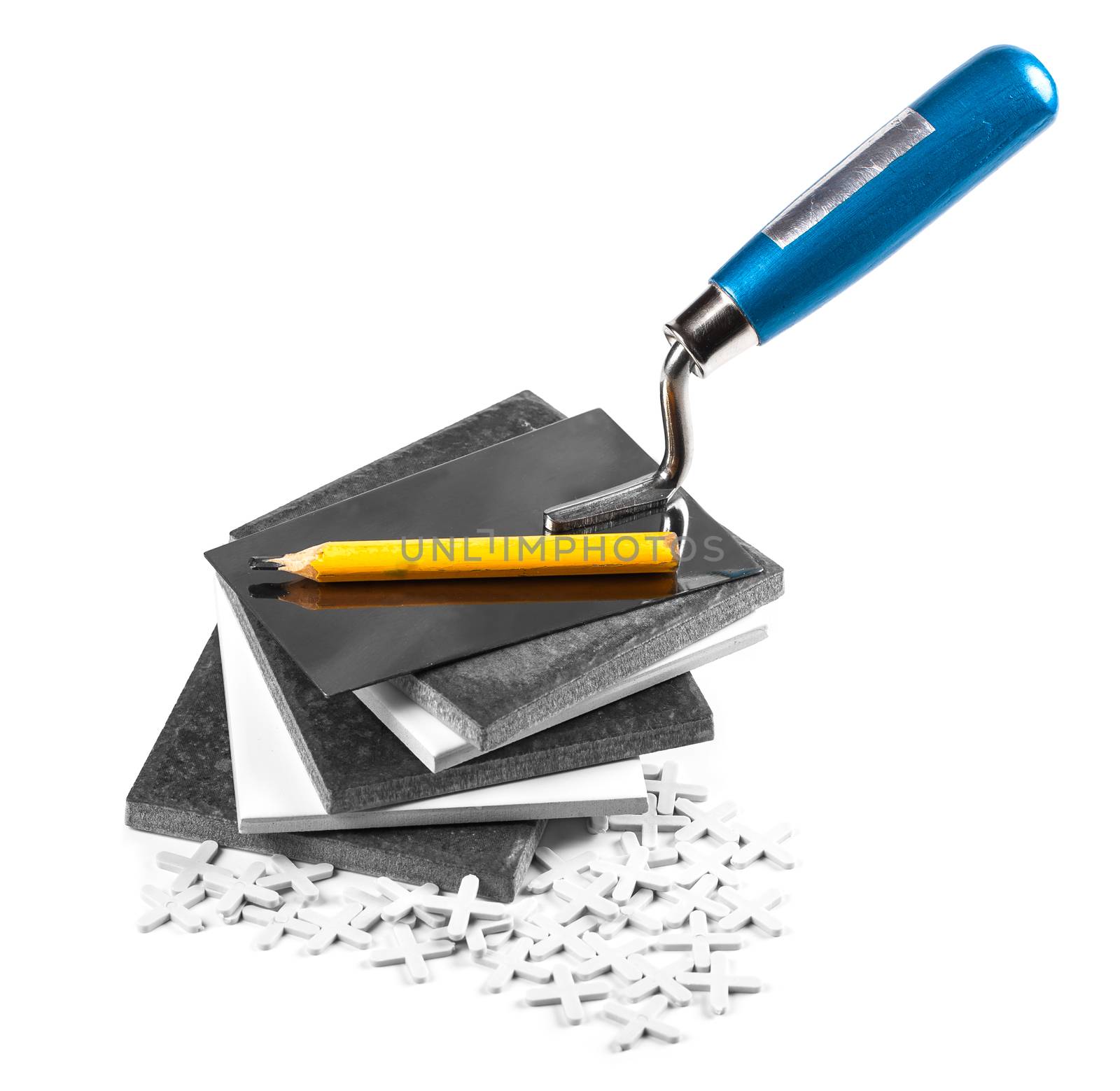 ceramic tiles and tools closeup on white background