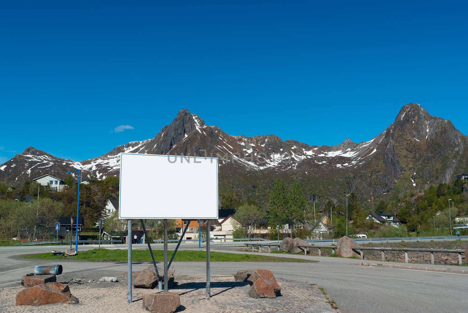 Big white bilboard on the norwegian road in sunny day