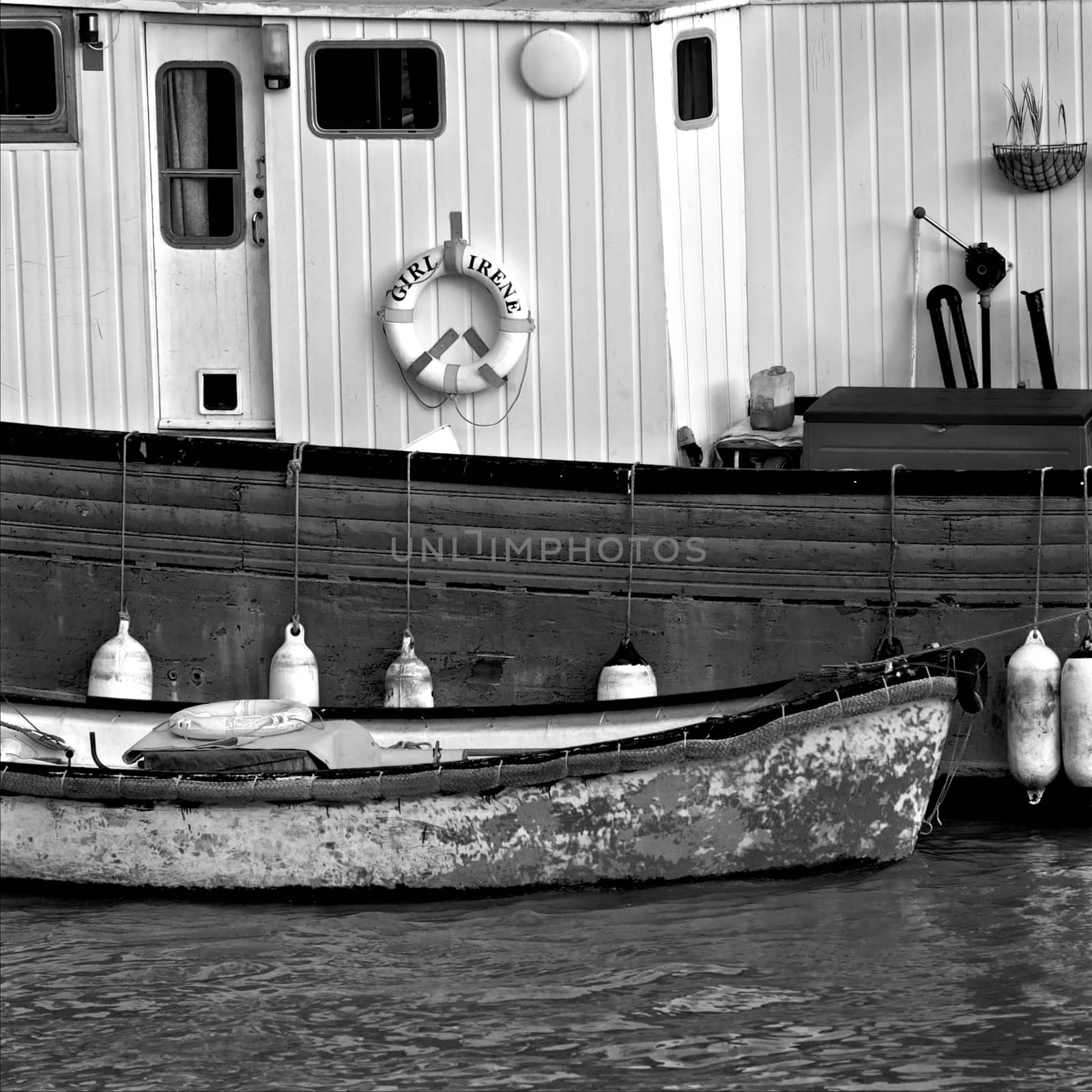 Weathered wooden boats docked in London