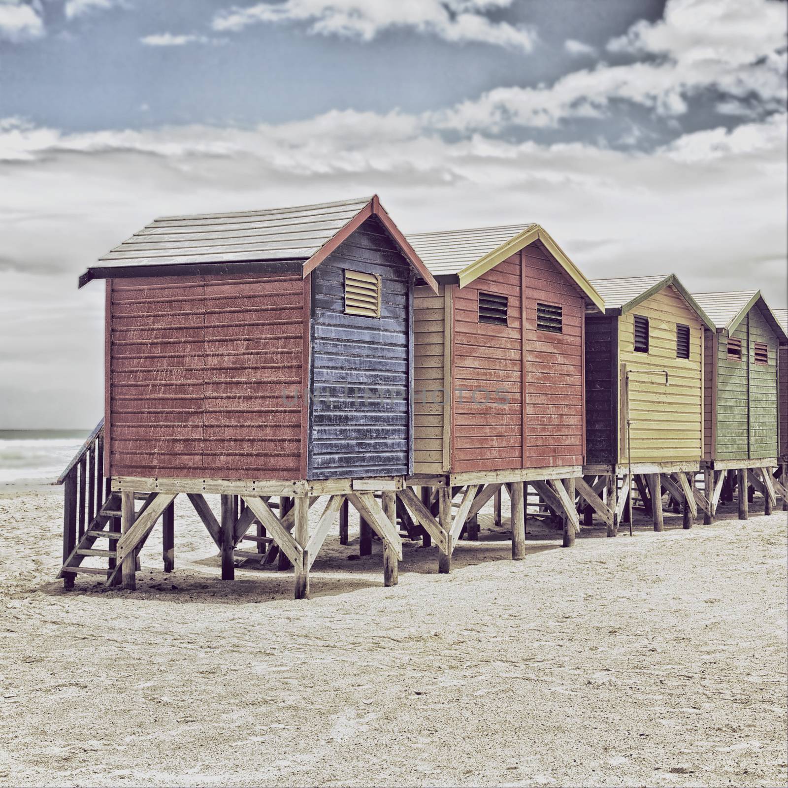 Row of painted colored beach huts in Cape Town, South Africa