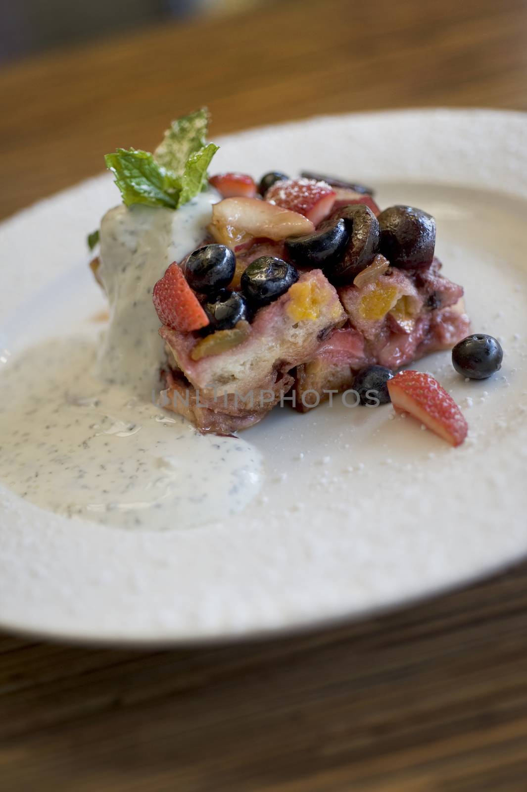 Desert of fresh berries and cream with cake and vanilla