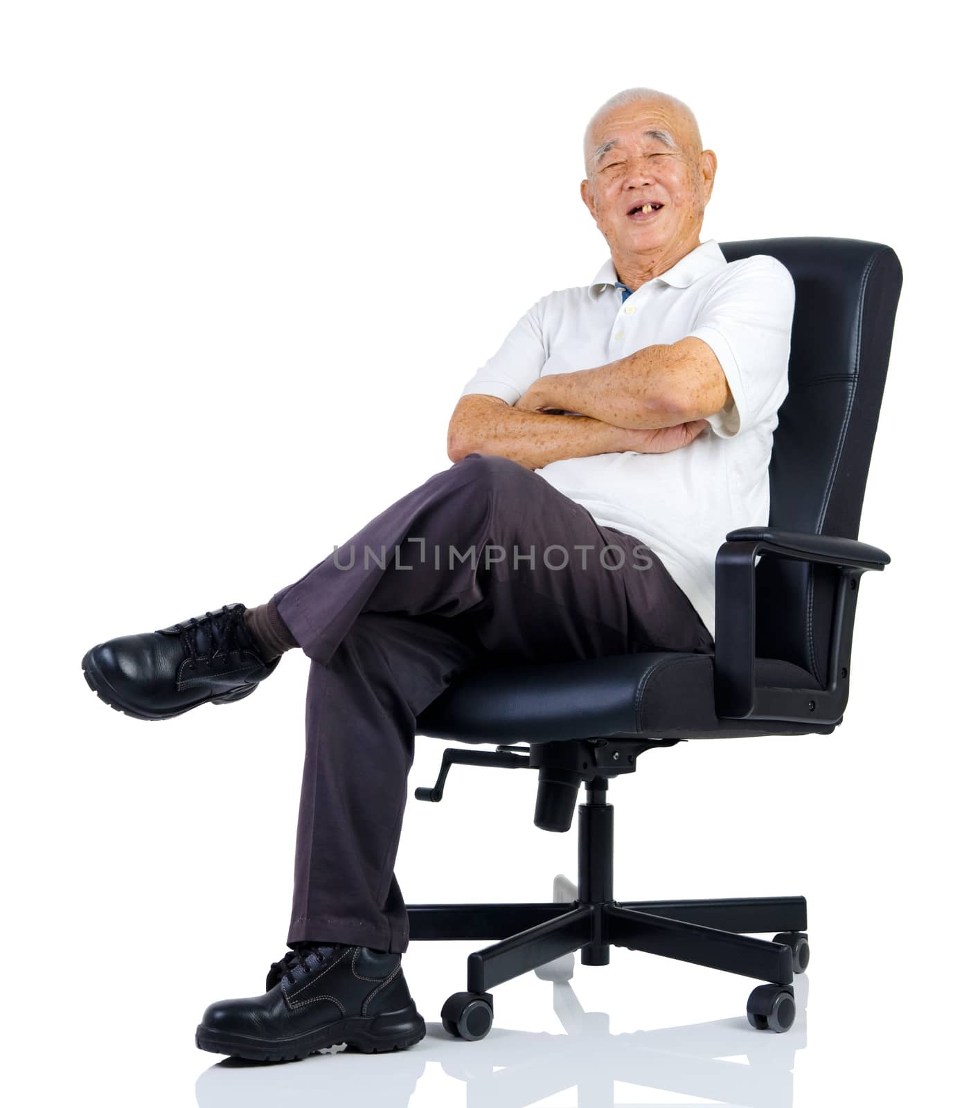 senior man resting in armchair isolated on white background