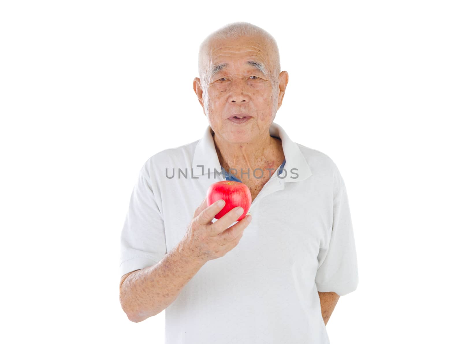 Old man holding an apple - isolated