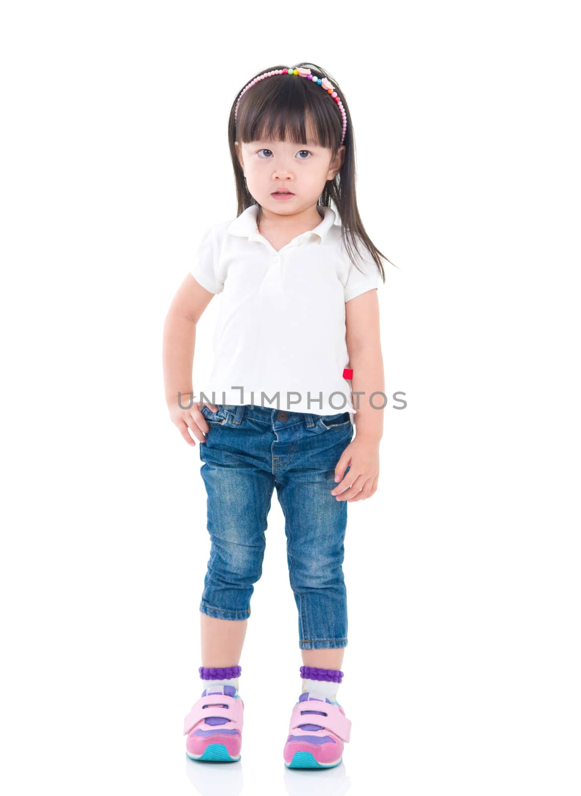 Little asian girl posing isolated on white background