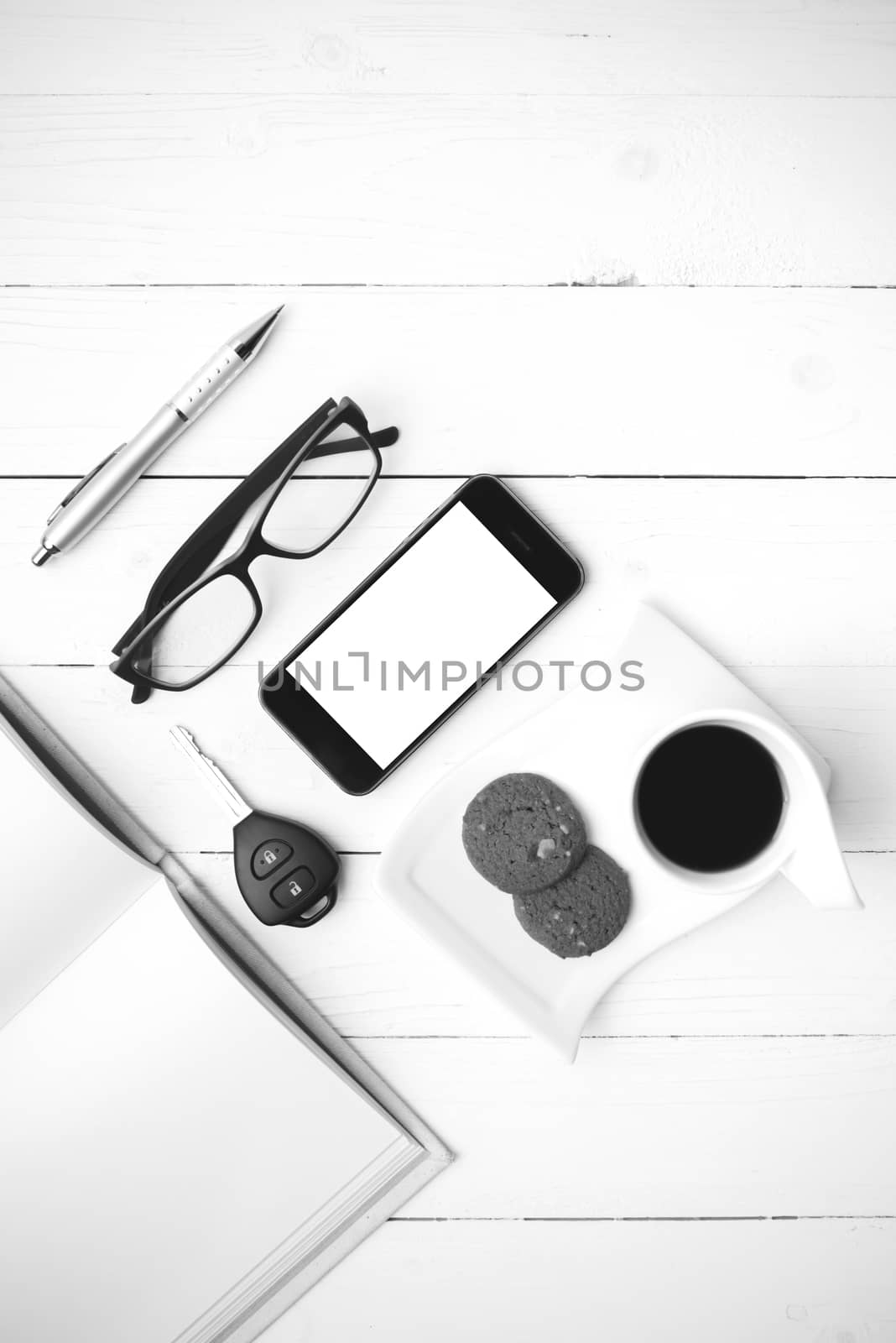 coffee cup with cookie,phone,open notebook,car key and eyeglasse by ammza12