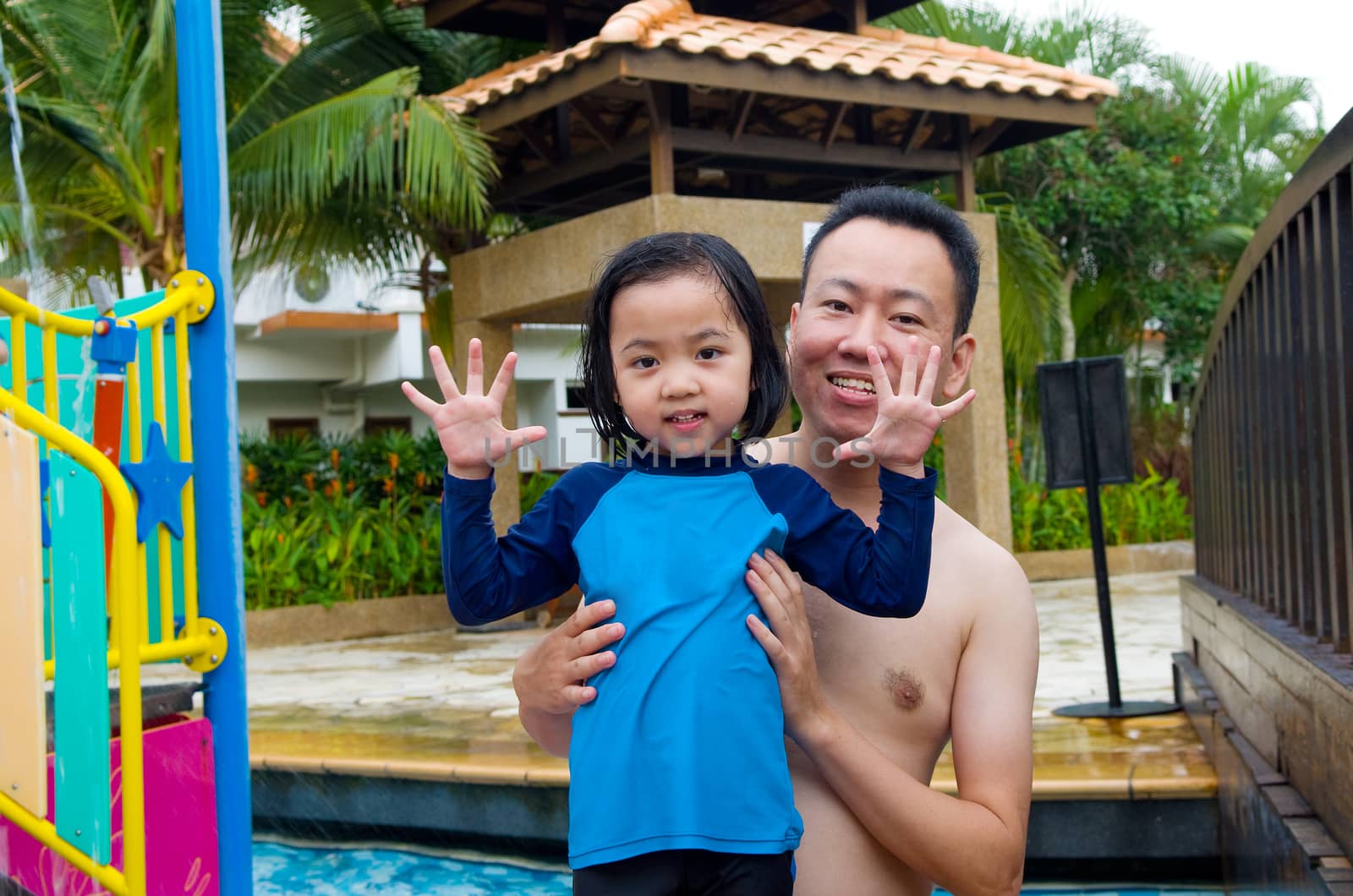 happy family in the swimming pool