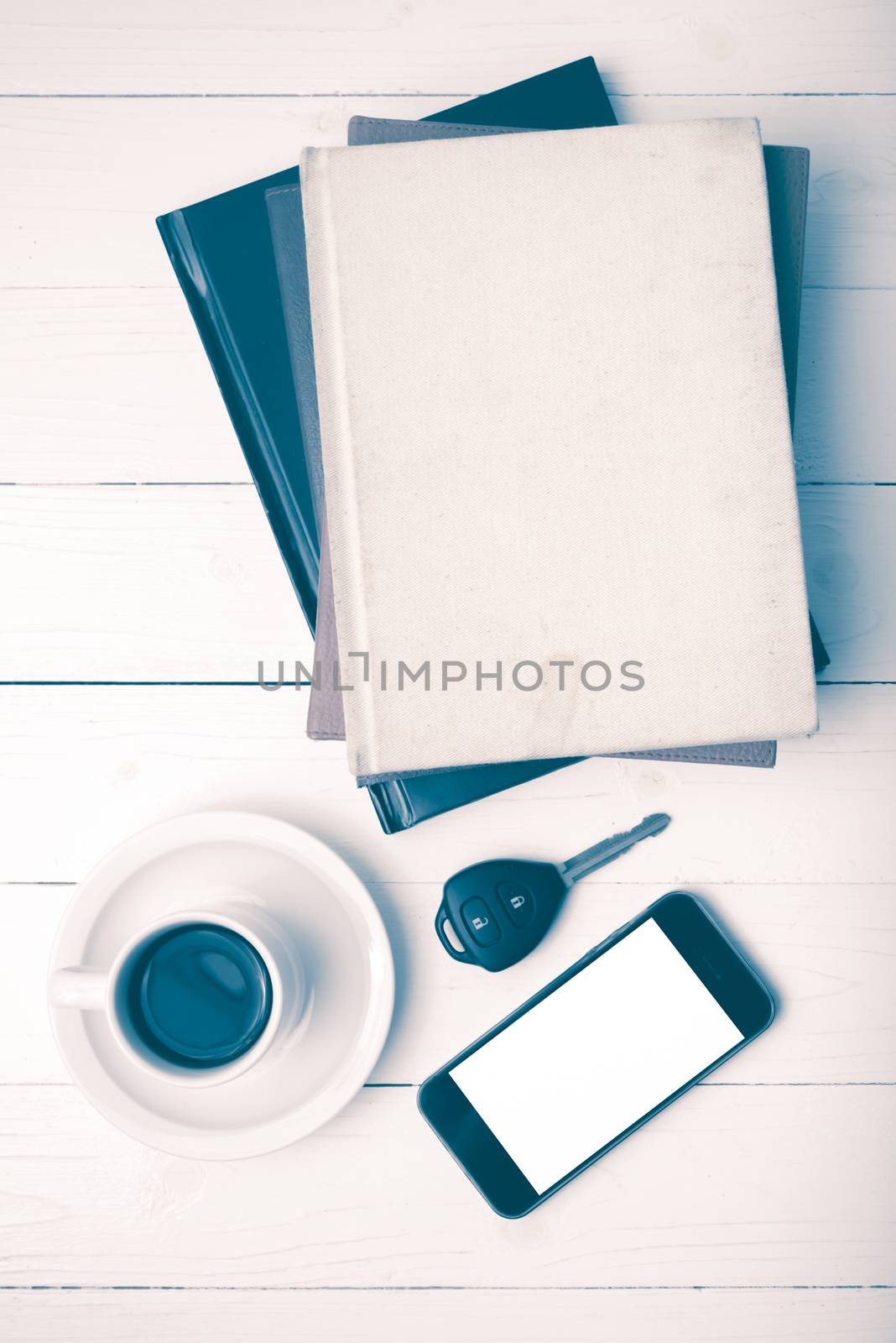 coffee cup with phone,car key and stack of book vintage style by ammza12