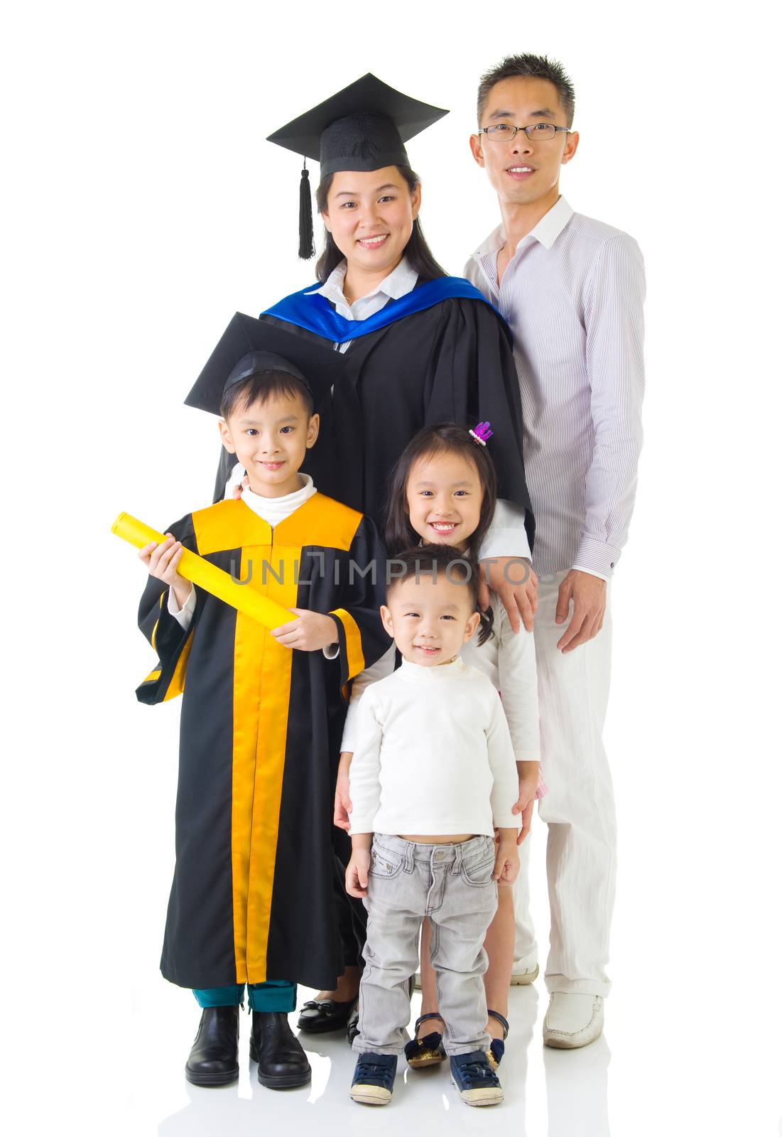Asian mother and son in graduation gown.Taking photo with family.