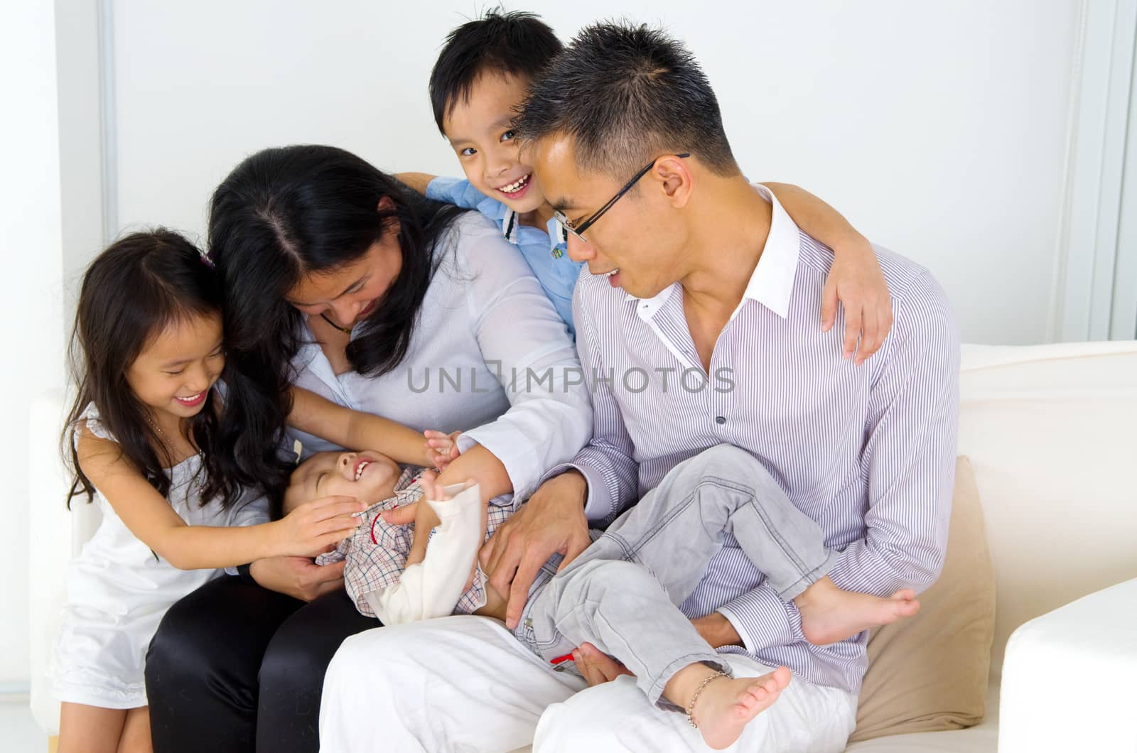 Asian family having fun at home