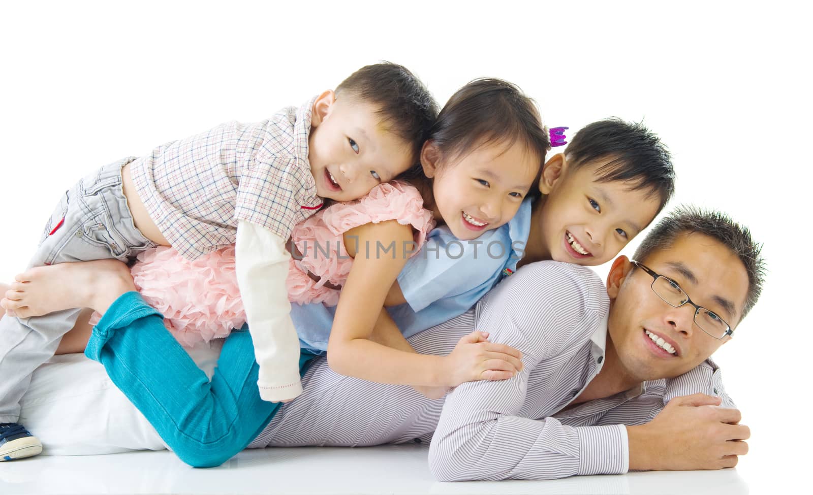 Asian family having piggyback fun