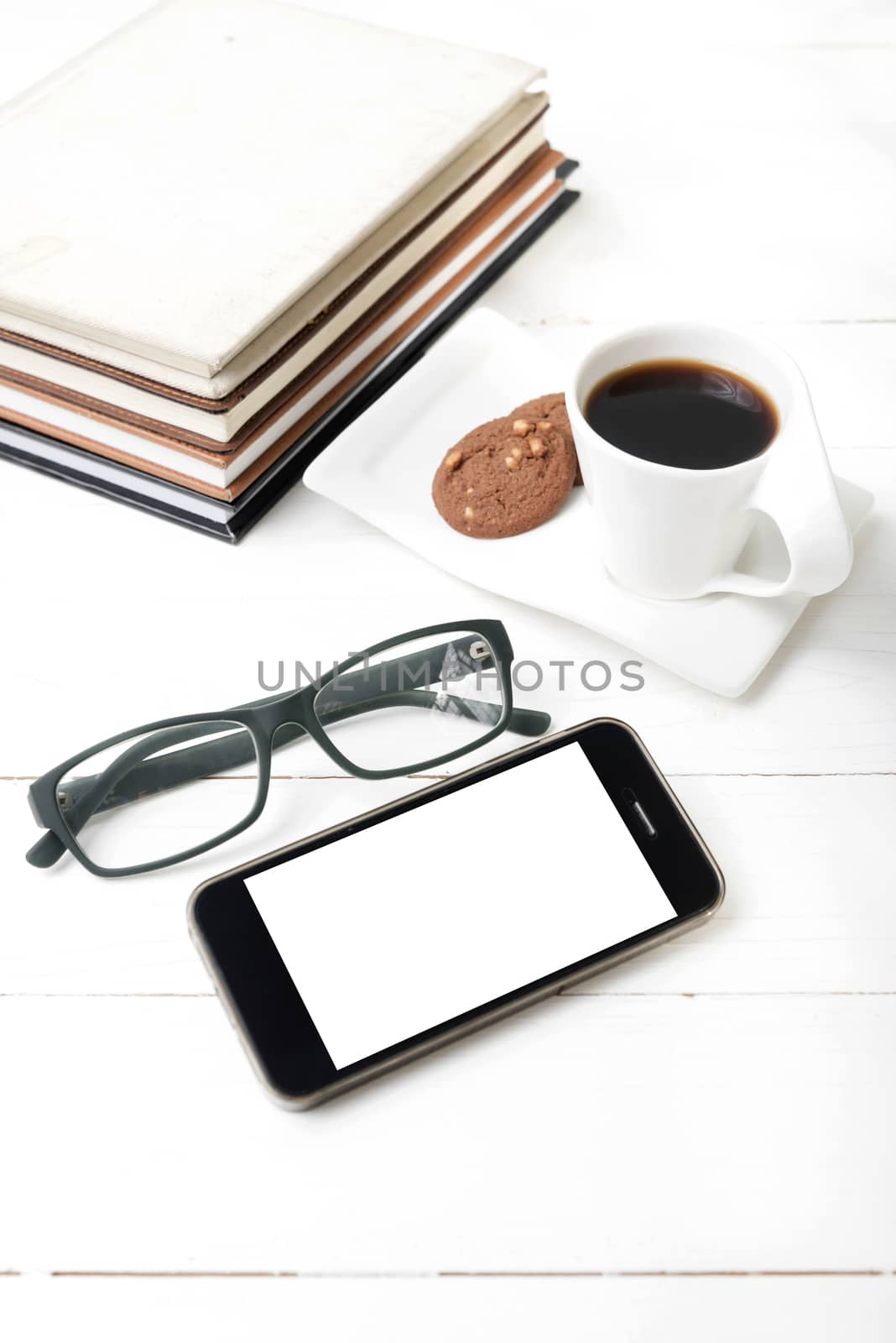 coffee cup with cookie,phone,stack of book and eyeglasses by ammza12