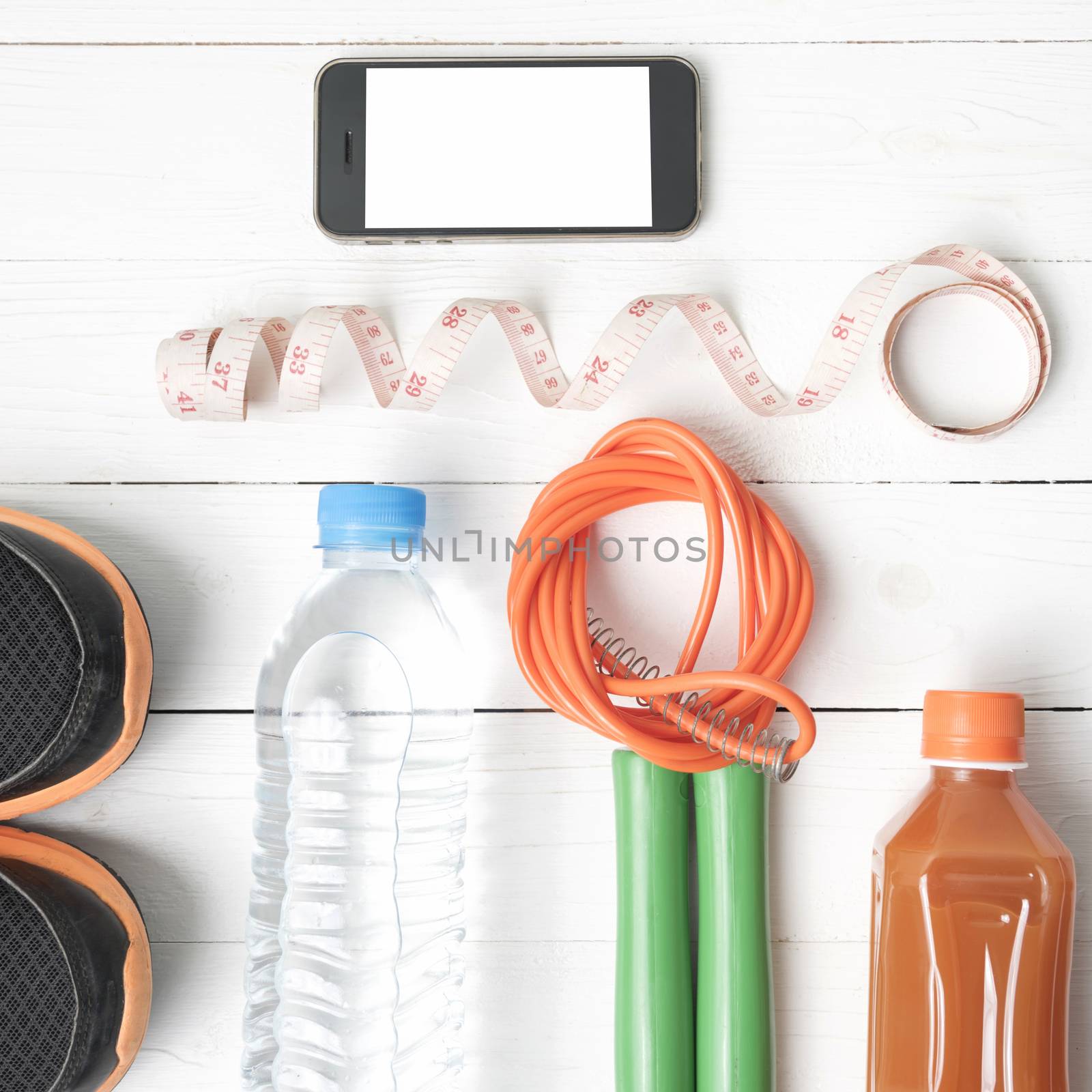 fitness equipment on white wood background by ammza12