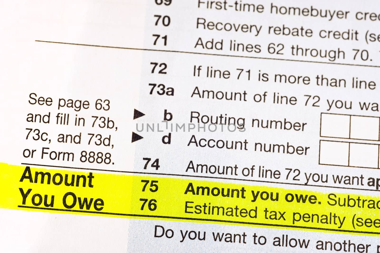 American income tax form with Amount You Owe highlighted in yellow.