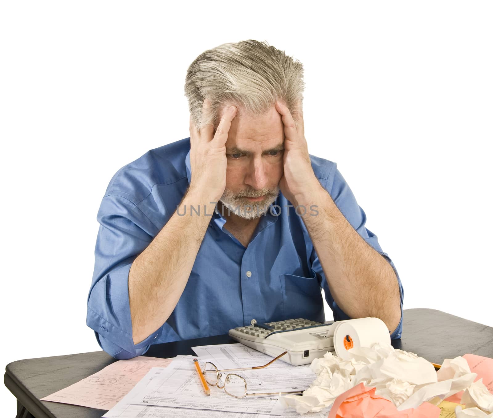 Man stressed out with a tax headache. Shot on white background