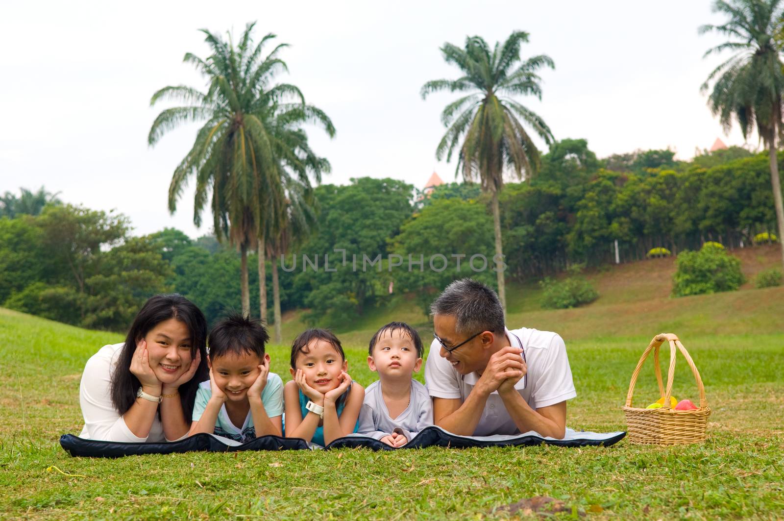 Outdoor portrait of asian family