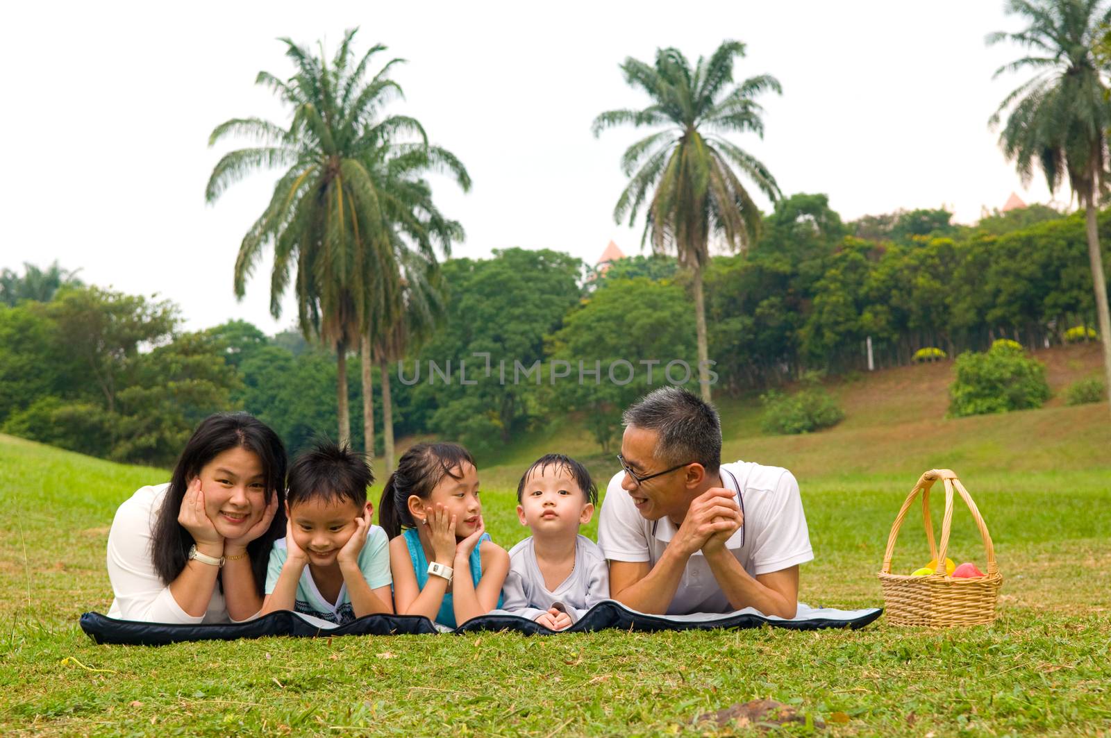 Outdoor portrait of asian family