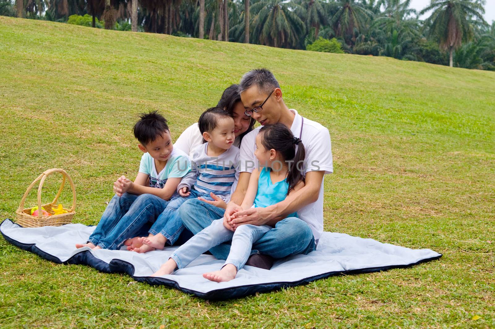 asian family having fun time at outdoor