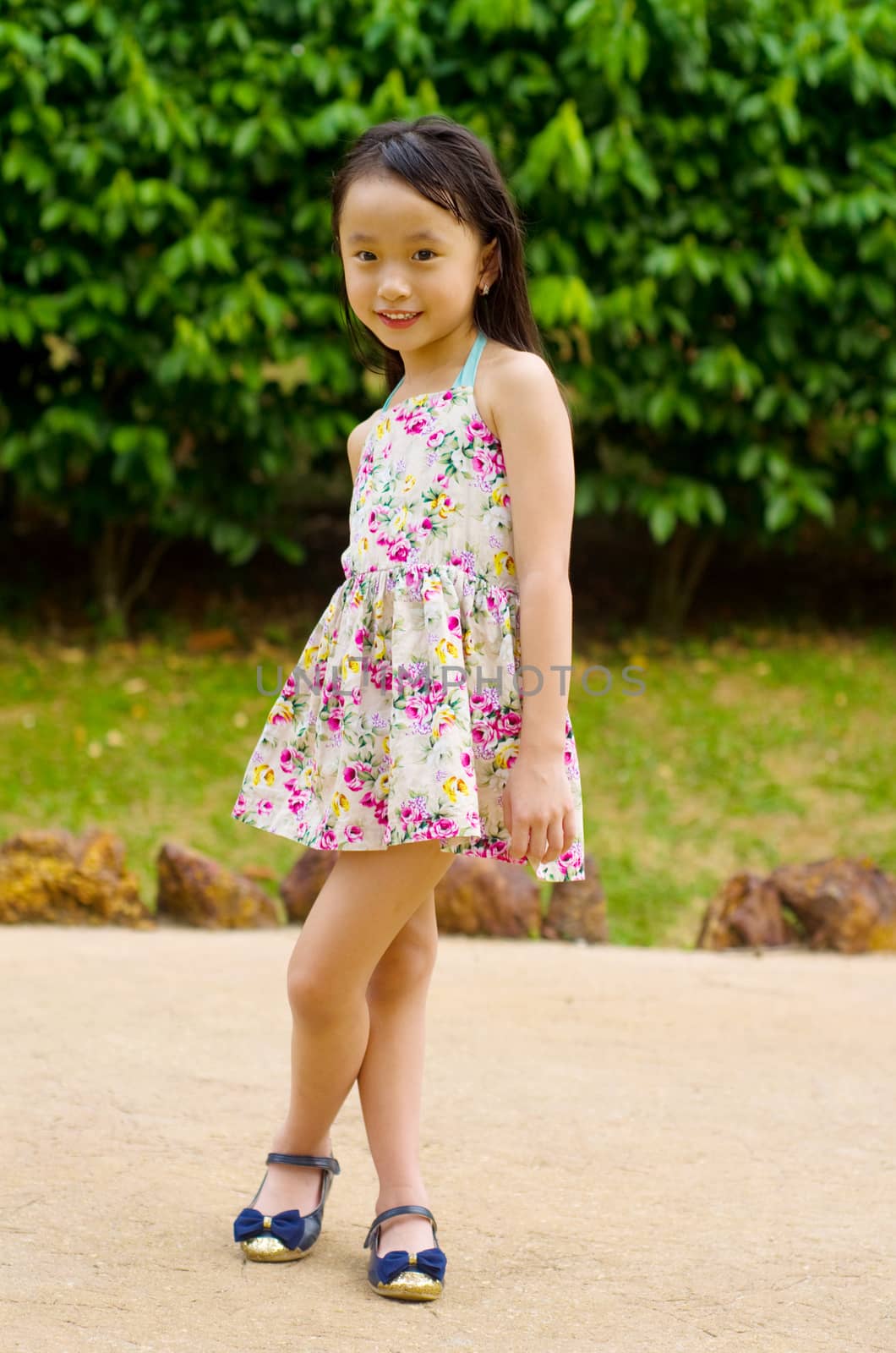 Outdoor portrait of little asian girl