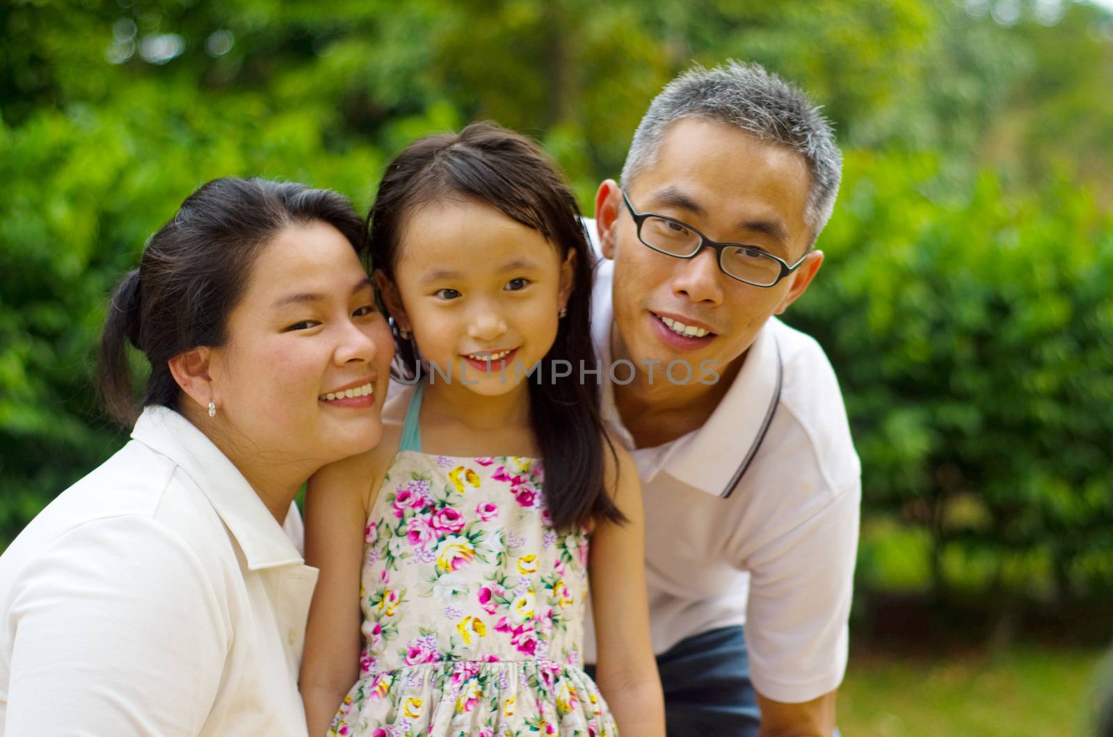 Outdoor portrait of asian family