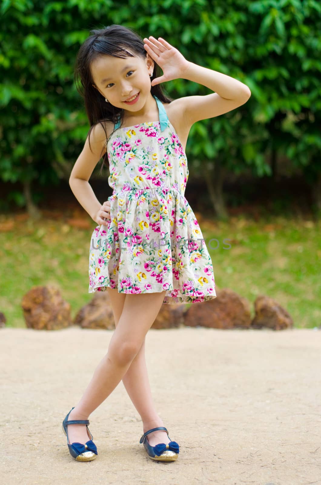 Outdoor portrait of little asian girl