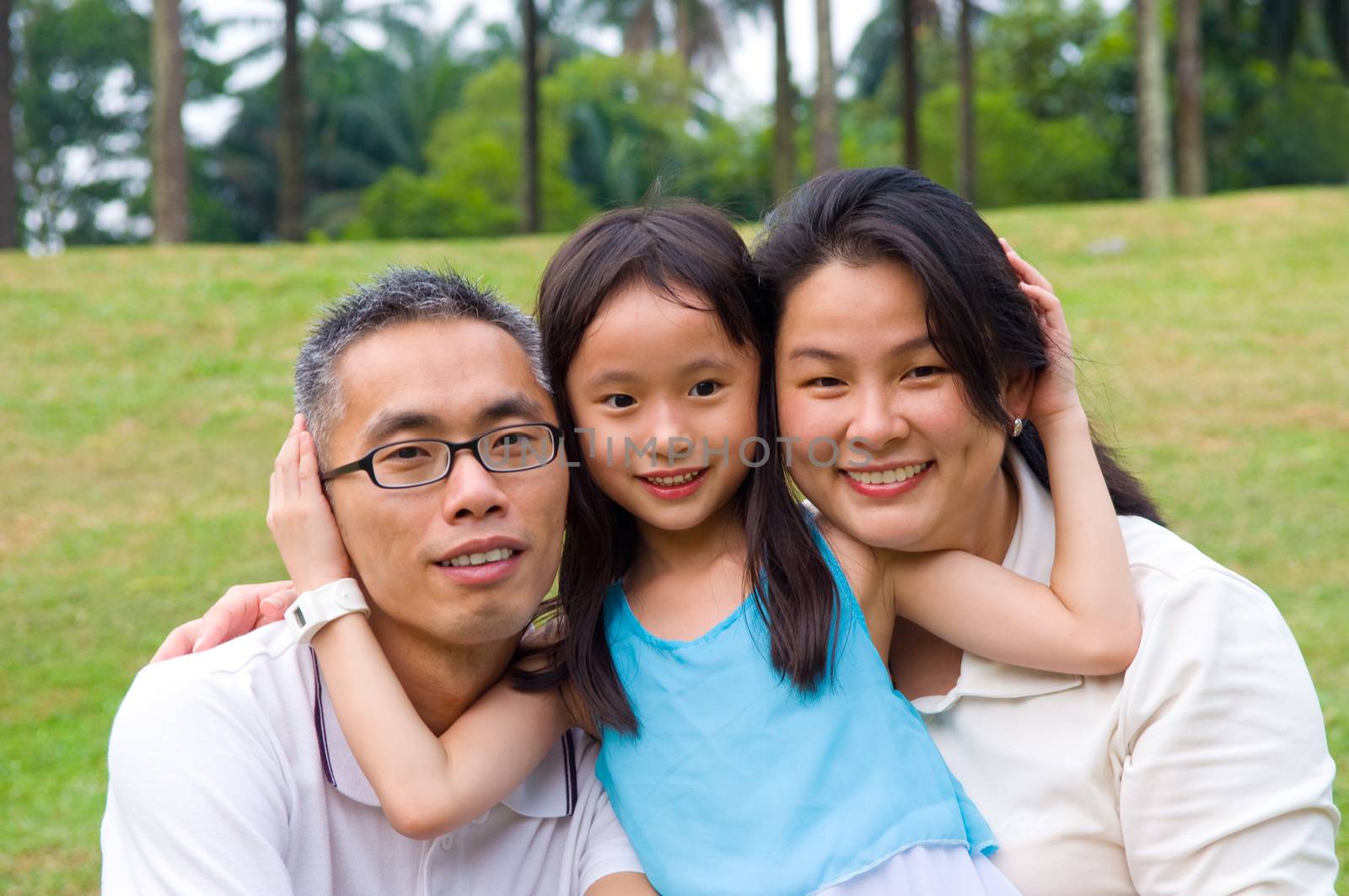 Outdoor portrait of asian family