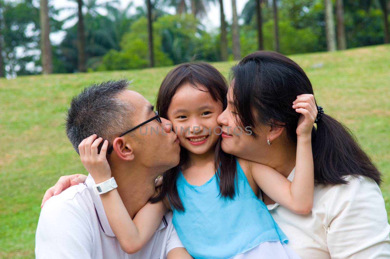 Outdoor portrait of asian family