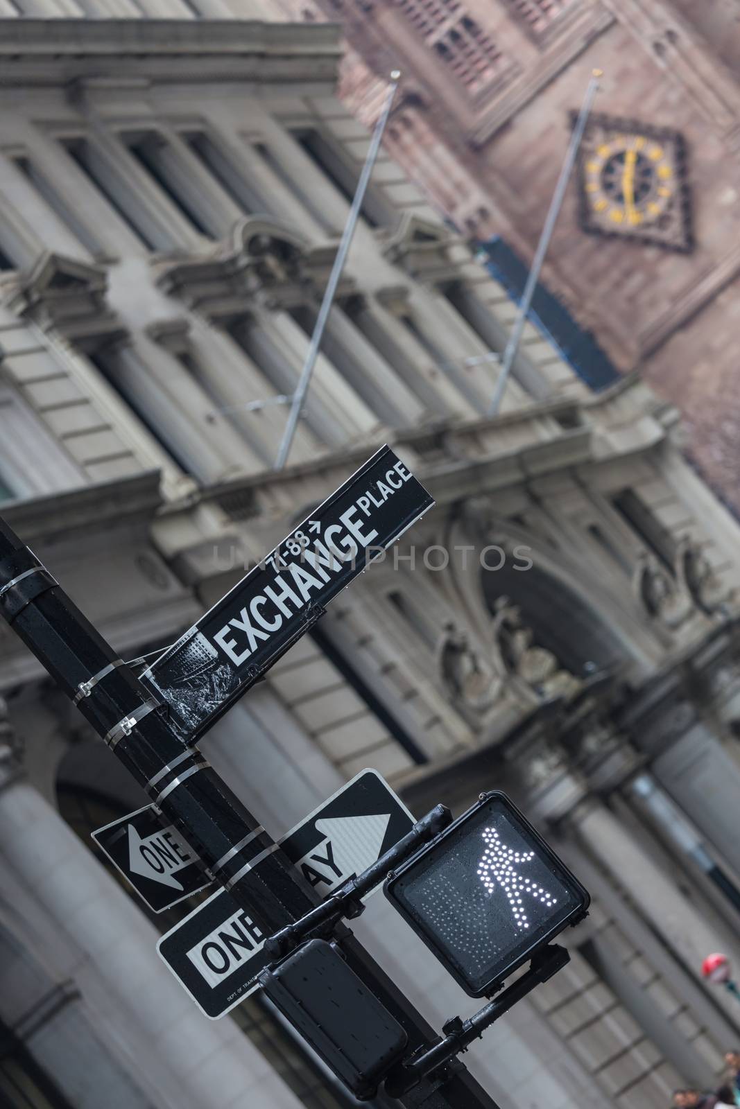 New York stock exchange street sign and go trafic light on a semaphore in New York City, USA. Invest. Bull market ahead.