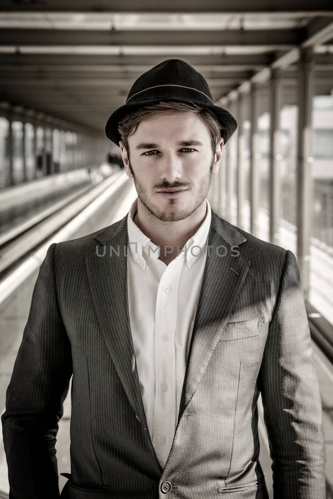 Man Wearing Hat and Looking Out Window by artofphoto