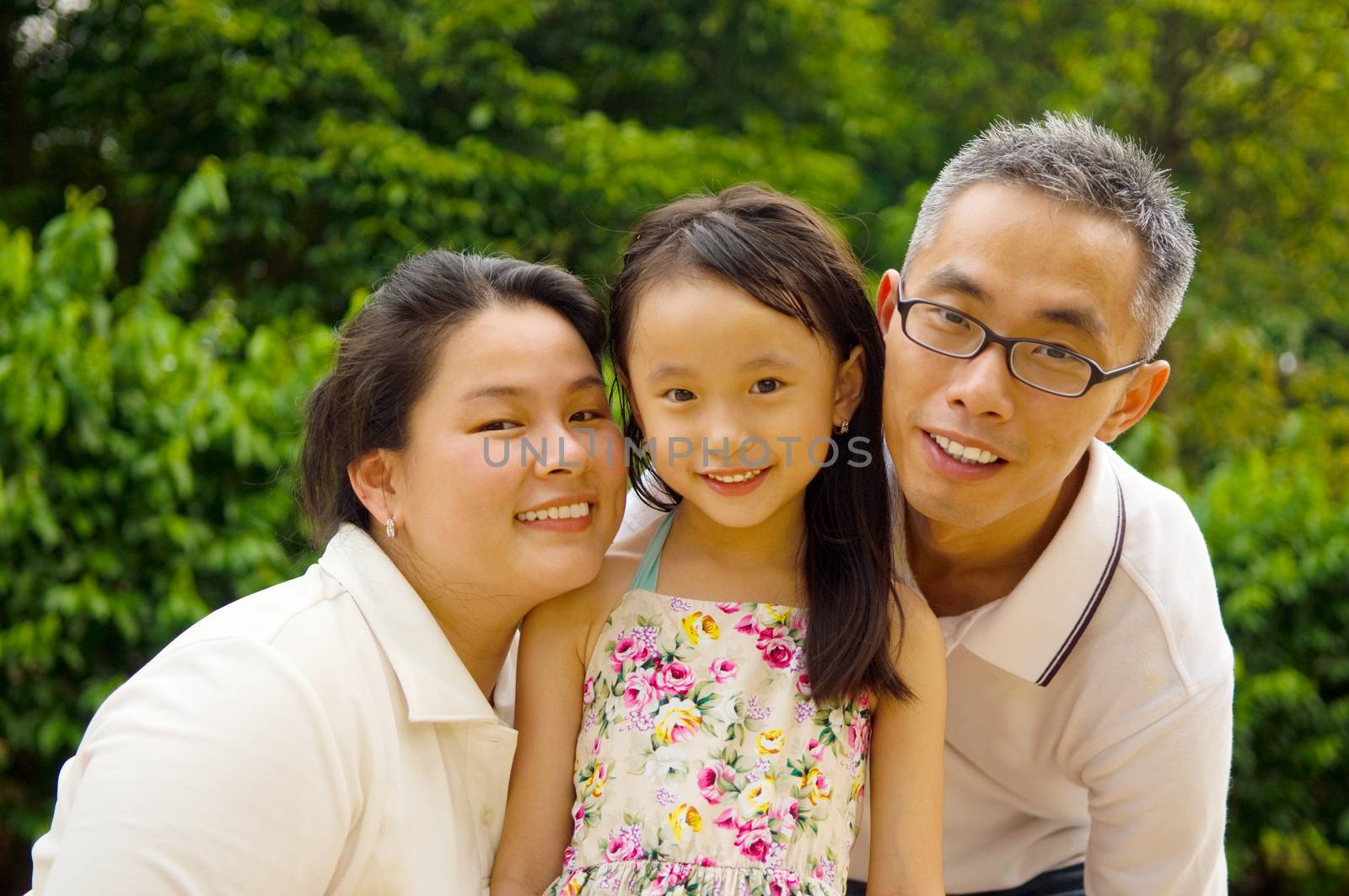 Outdoor portrait of asian family