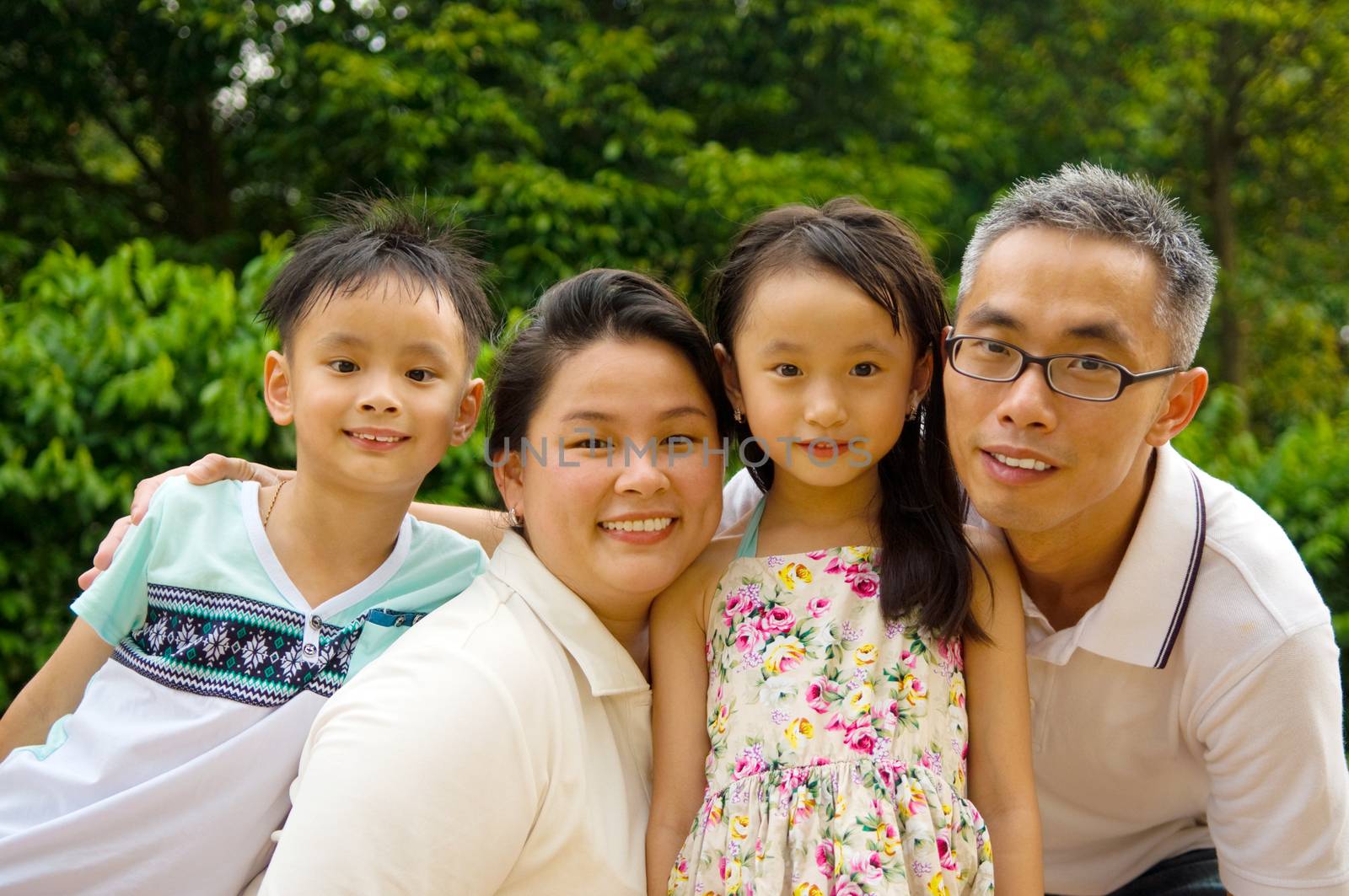 Outdoor portrait of asian family