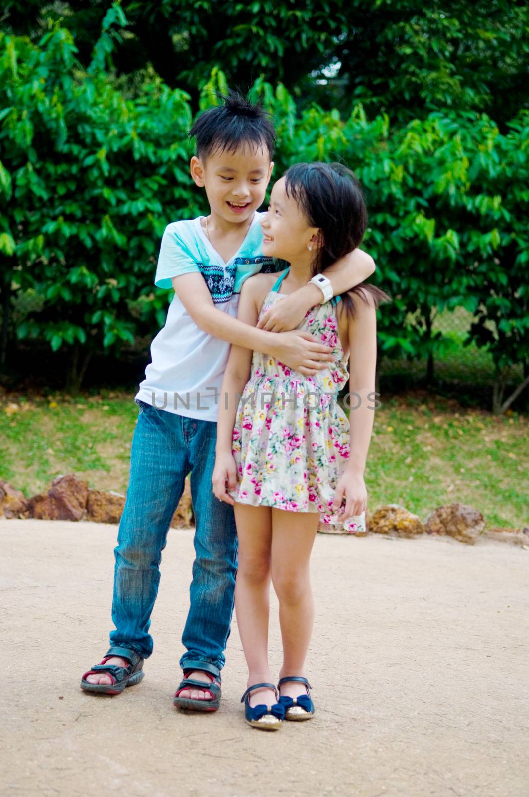 Outdoor portrait of little asian kids