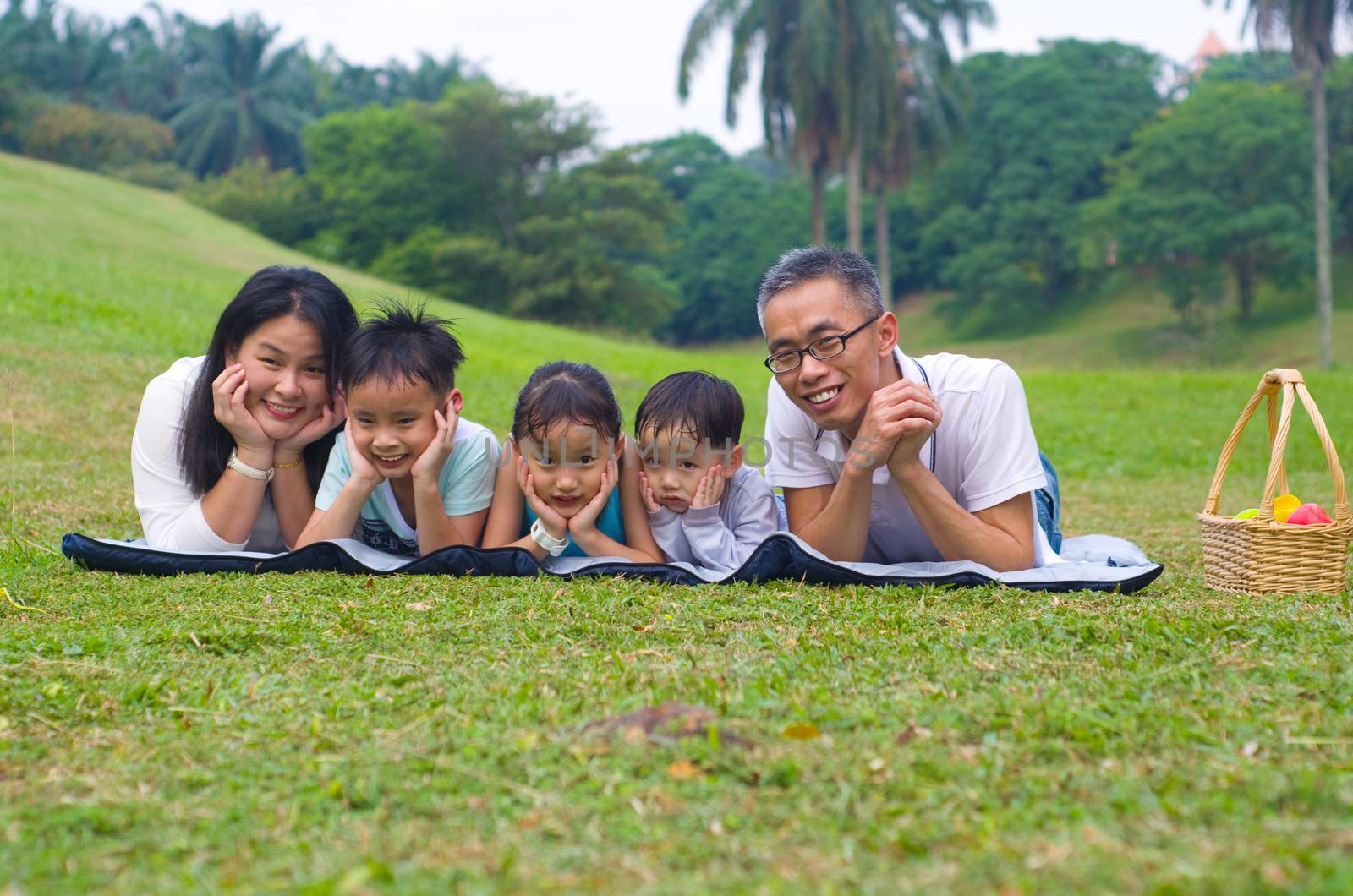 Outdoor portrait of asian family